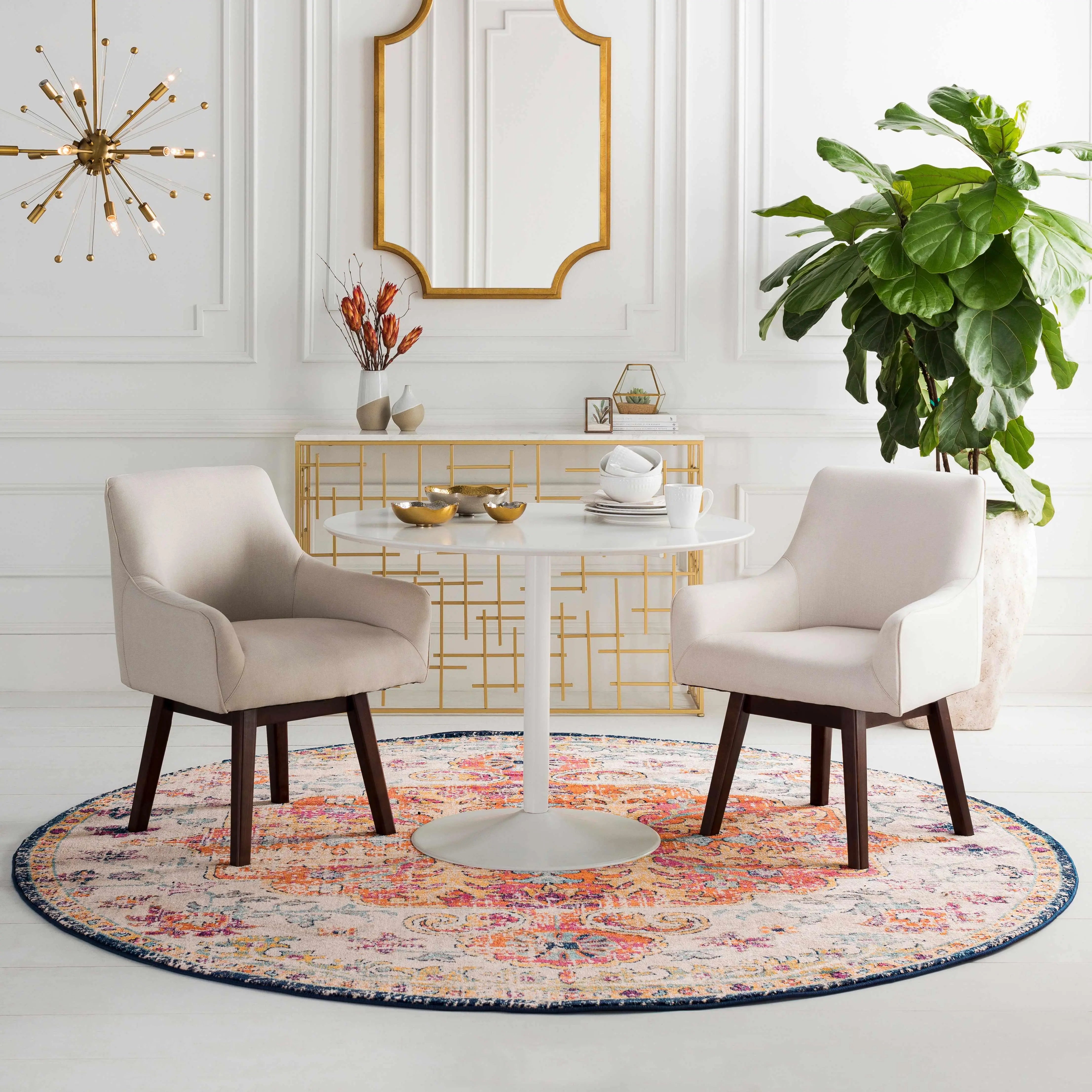 Cozy farmhouse dining setup with cream chairs, round table, and colorful rug
