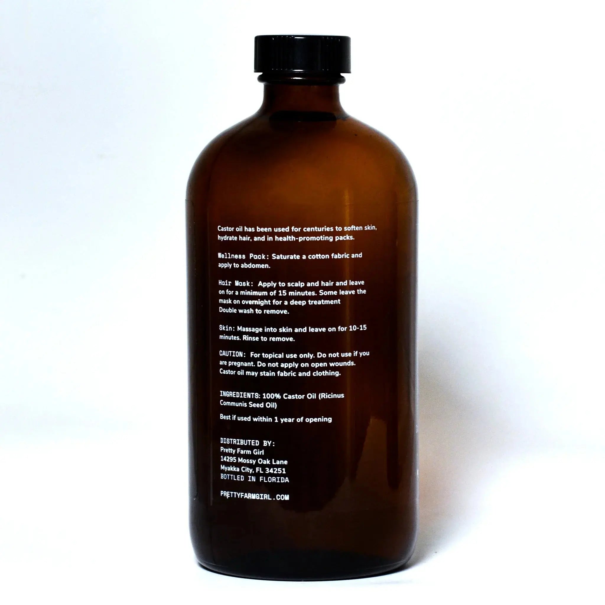 Amber glass bottle of 100% castor oil for skin, hair, and wellness packs, ideal for farmhouse bath essentials