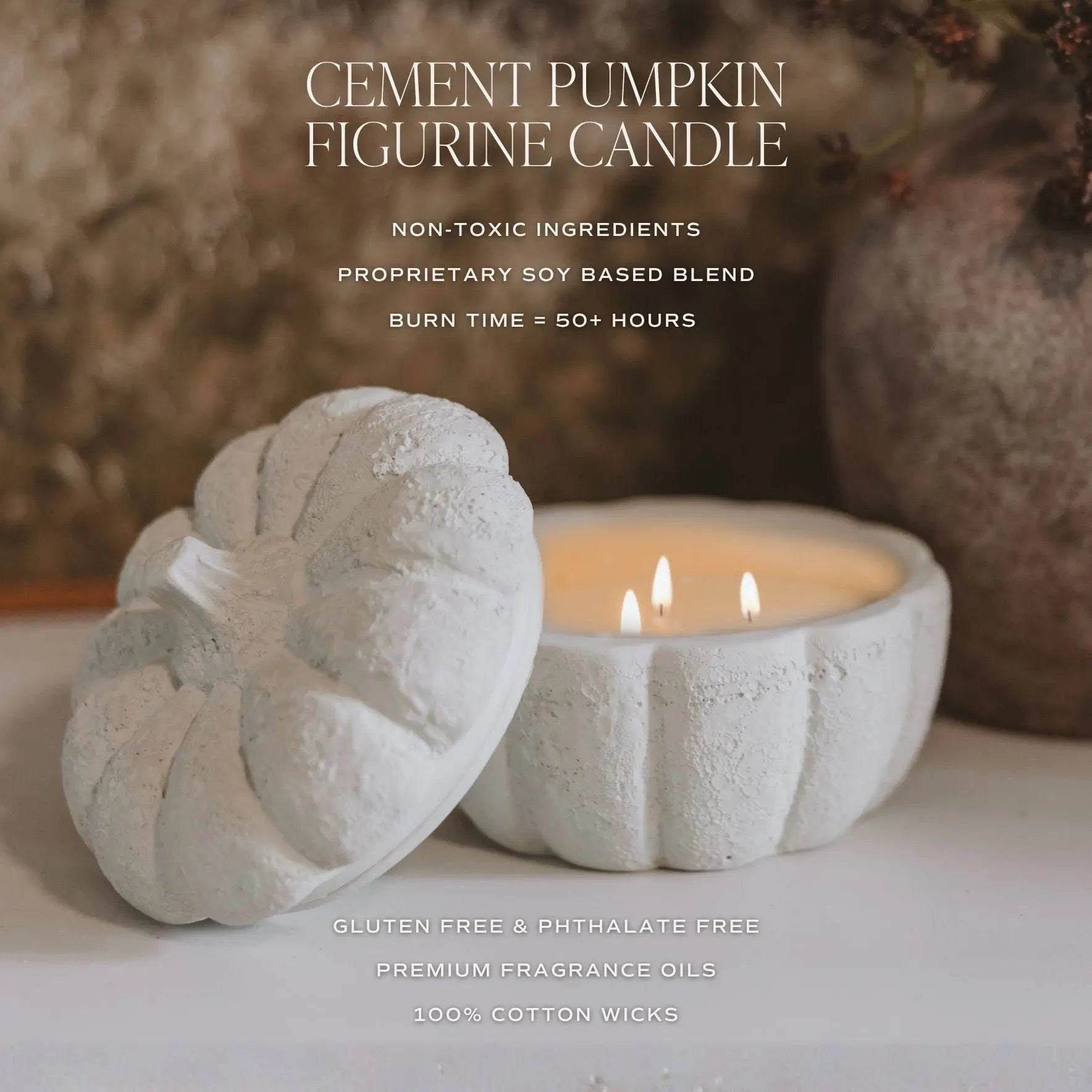 Cement pumpkin-shaped candle with a lit candle inside, set against a blurred natural background.