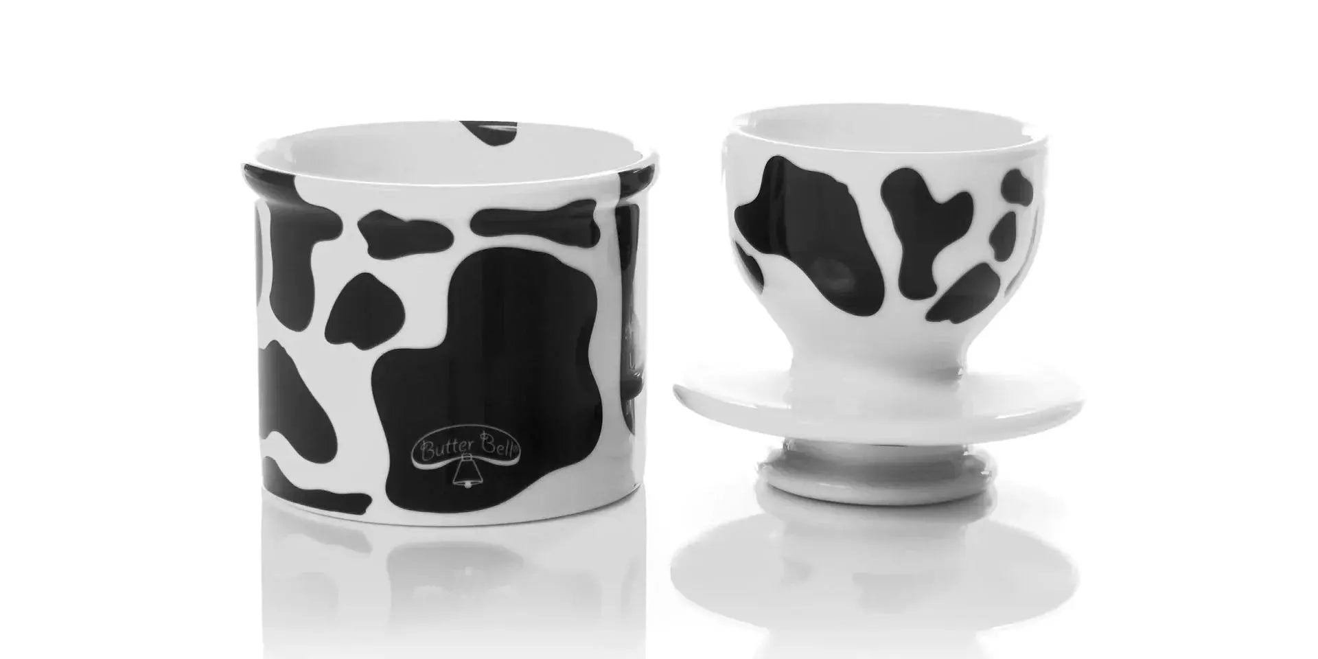 Cow print ceramic butter dish and egg cup, farmhouse kitchen decor with black and white spots