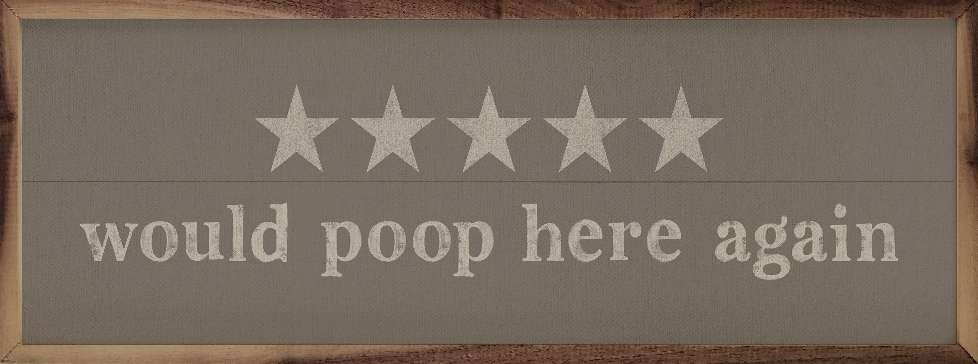 Wooden sign with five stars and text 'would poop here again' on a gray background