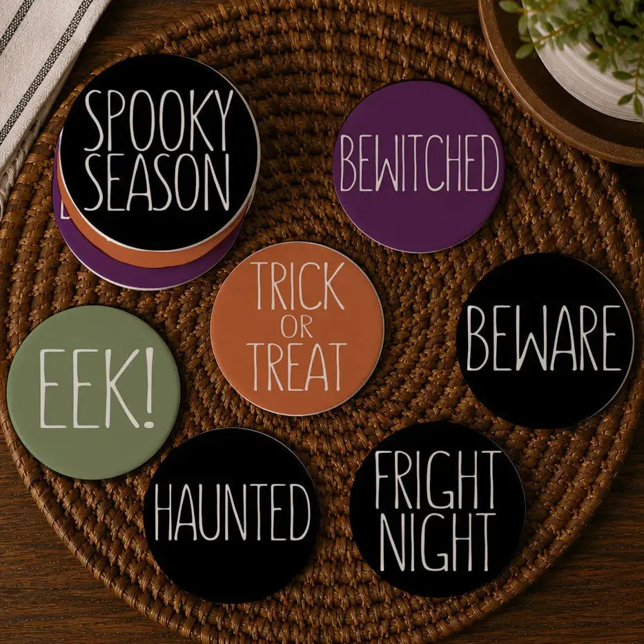 Set of Halloween-themed coasters on a woven mat