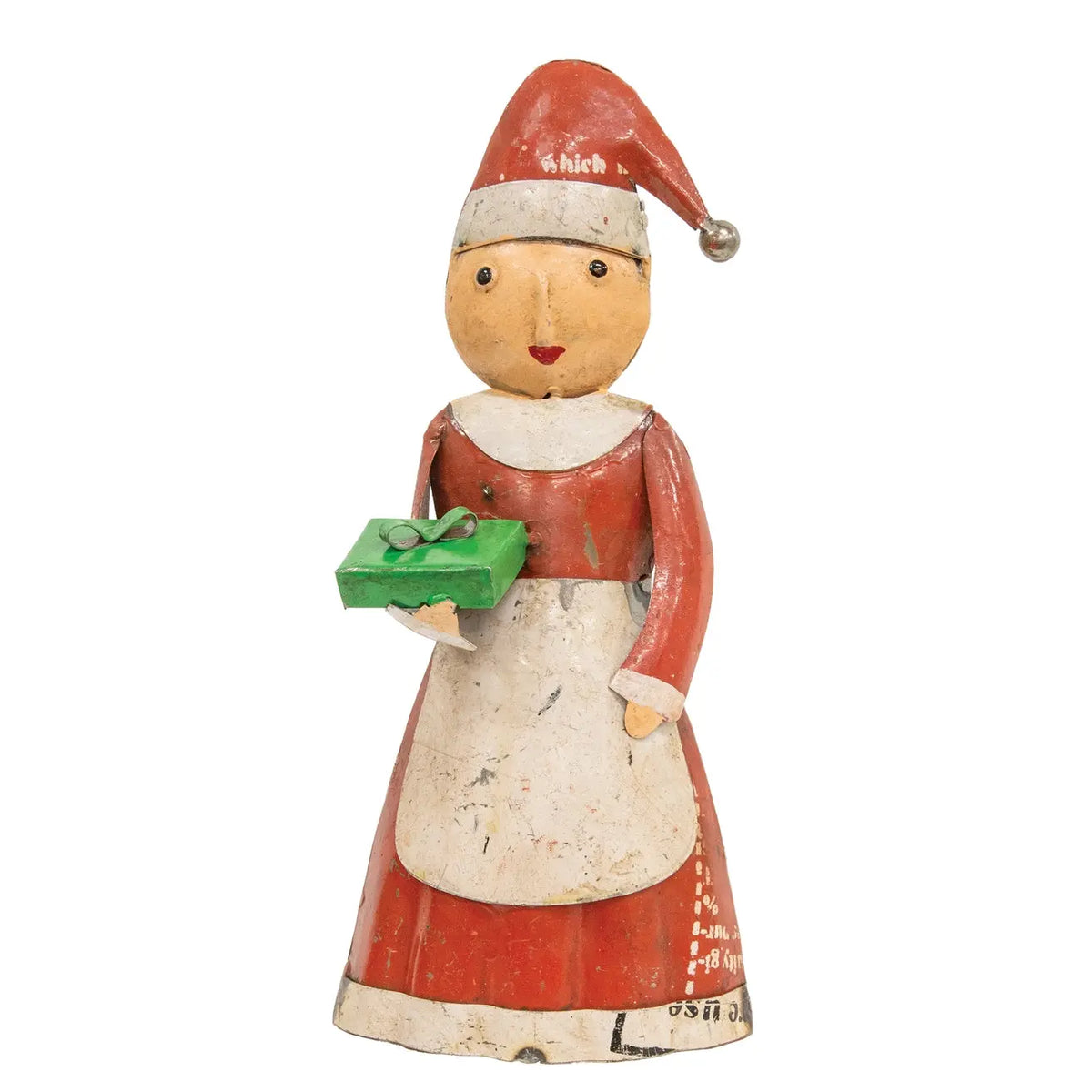 A vintage hand-painted wooden Christmas figurine of a woman in a red dress and white apron holding a green gift box, wearing a red Santa hat with 'shib' written on it, set against a plain white background.