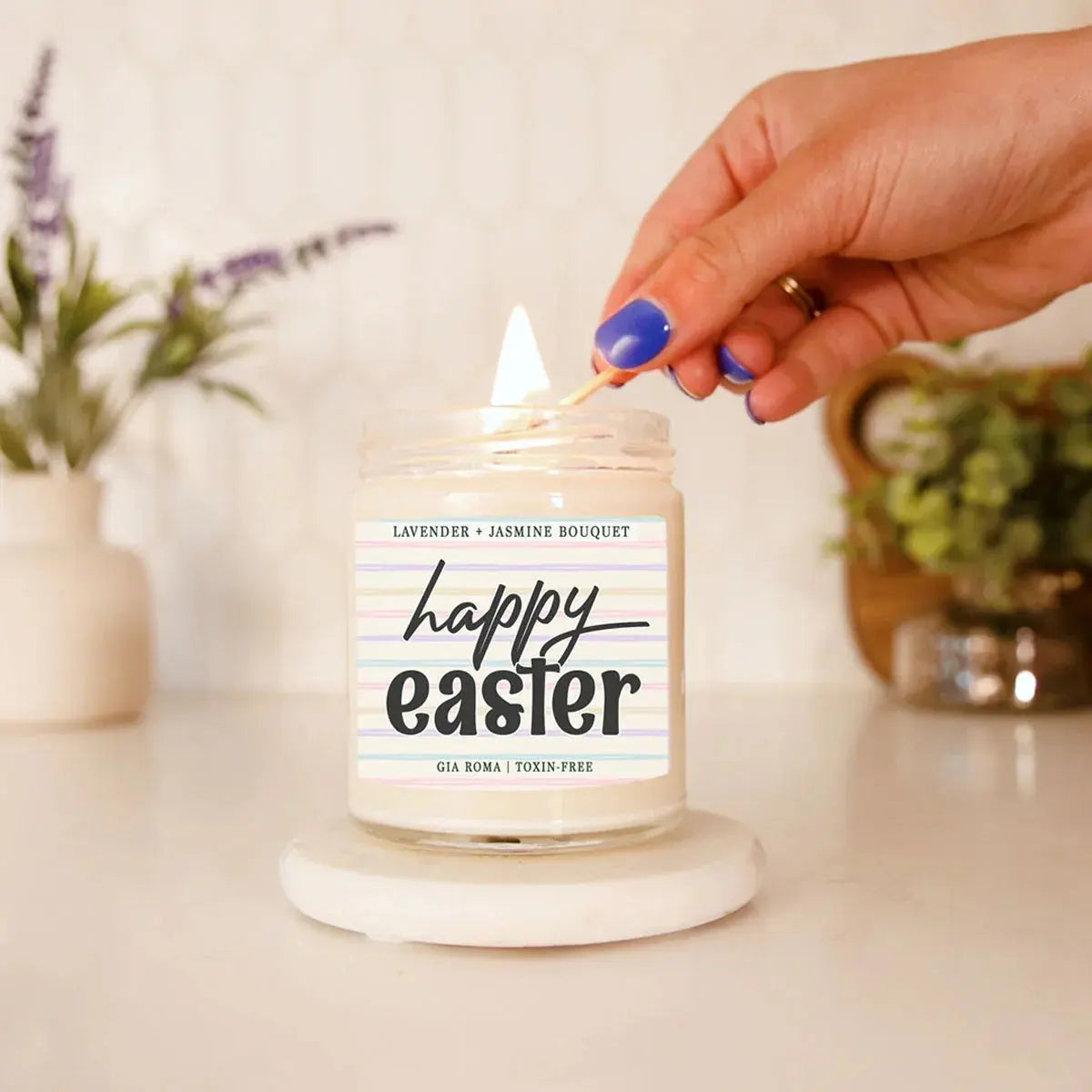 Candle being lit with a 'Happy Easter' label, surrounded by decorative plants.