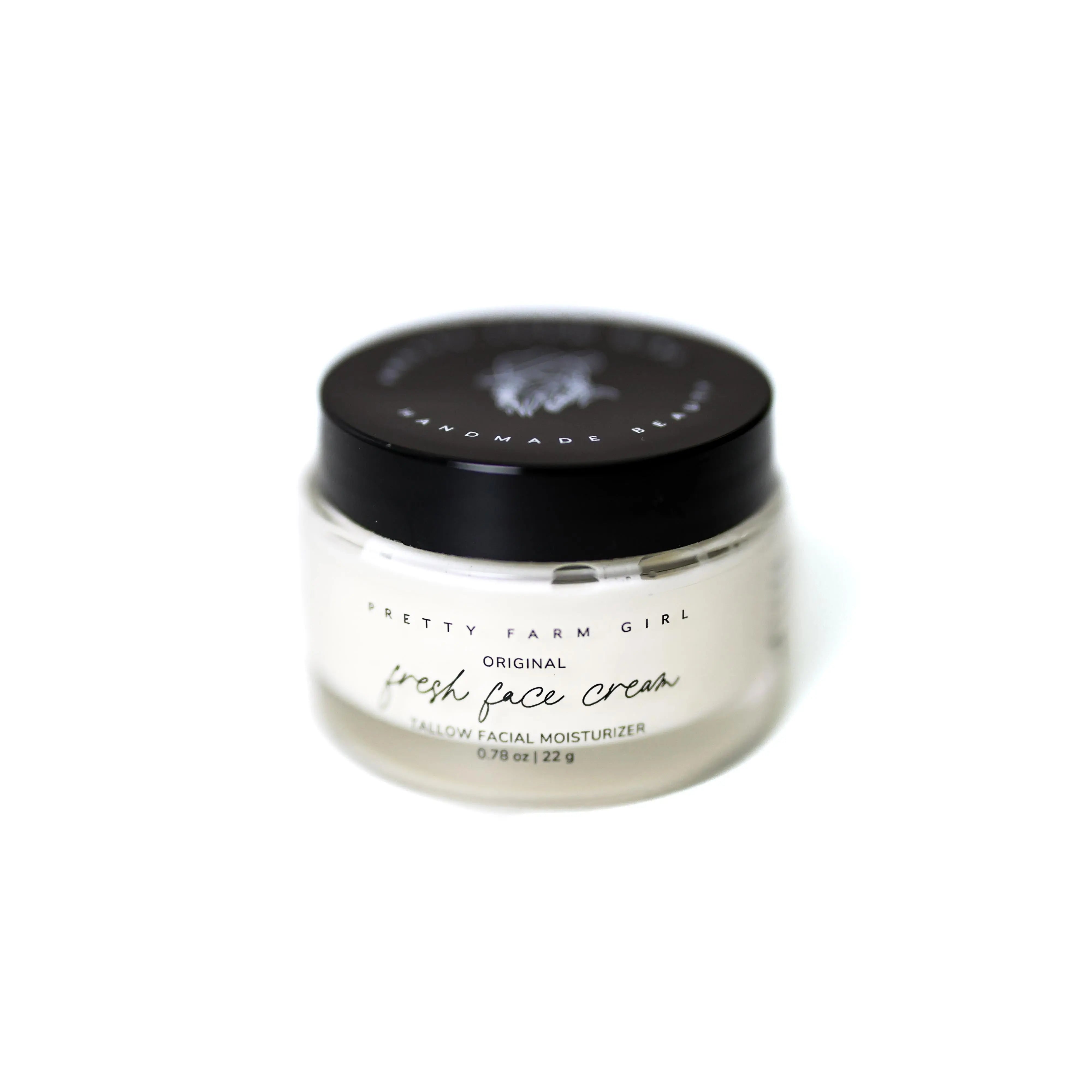 Pretty Farm Girl Original Fresh Face Cream, Tallow Facial Moisturizer in a clear jar with black lid