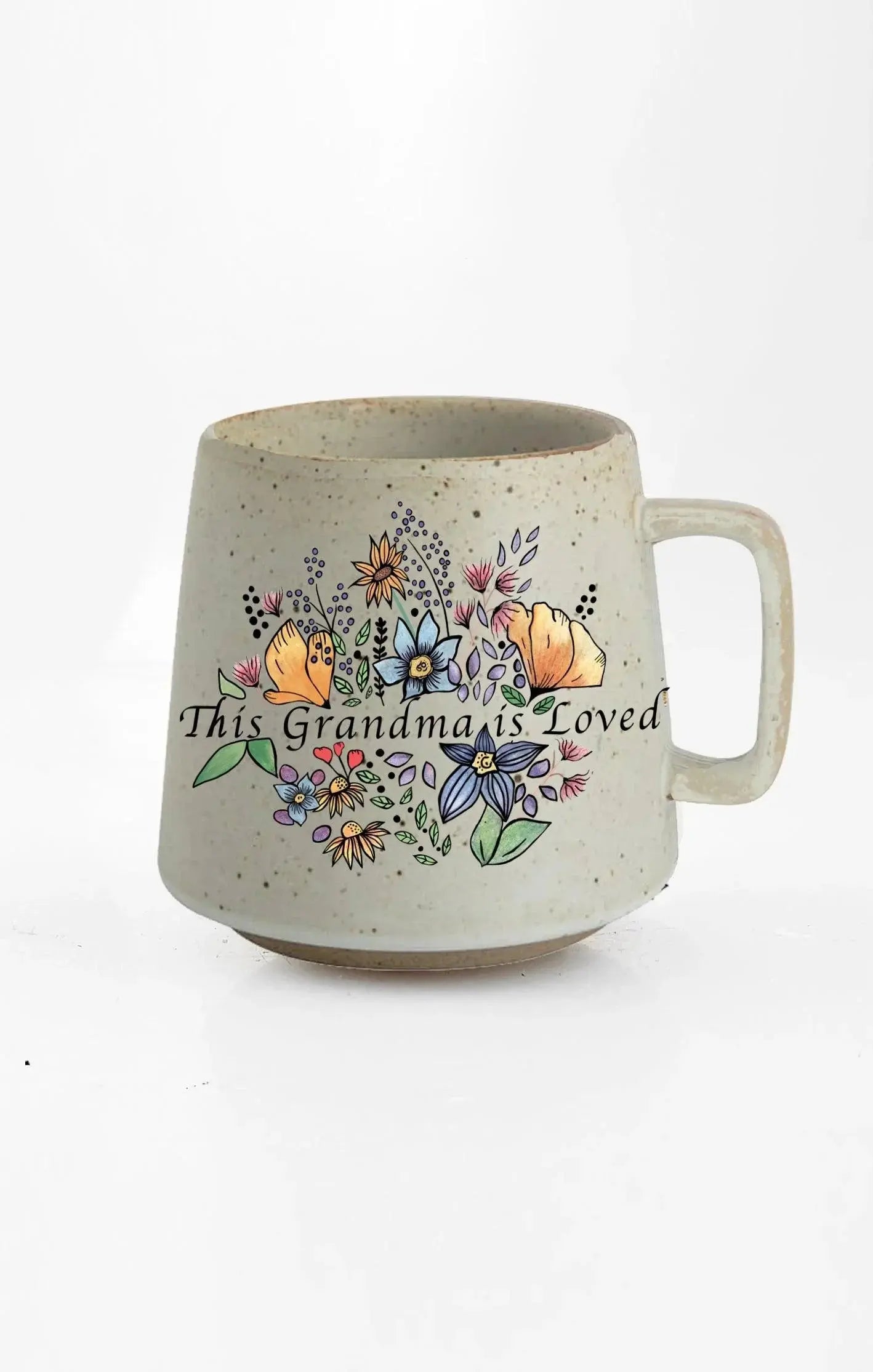 This Grandma is Loved floral mug, cozy farmhouse decor with colorful flowers and speckled ceramic design