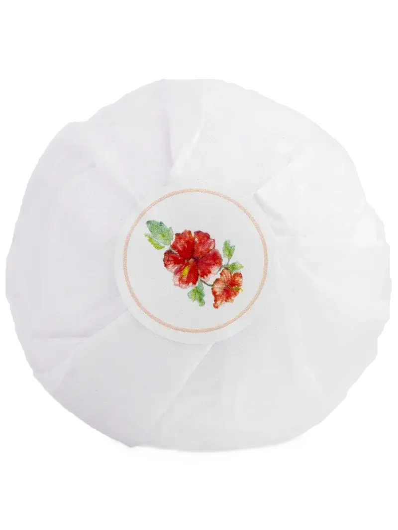 White floral bath bomb with red hibiscus design, cozy farmhouse home decor