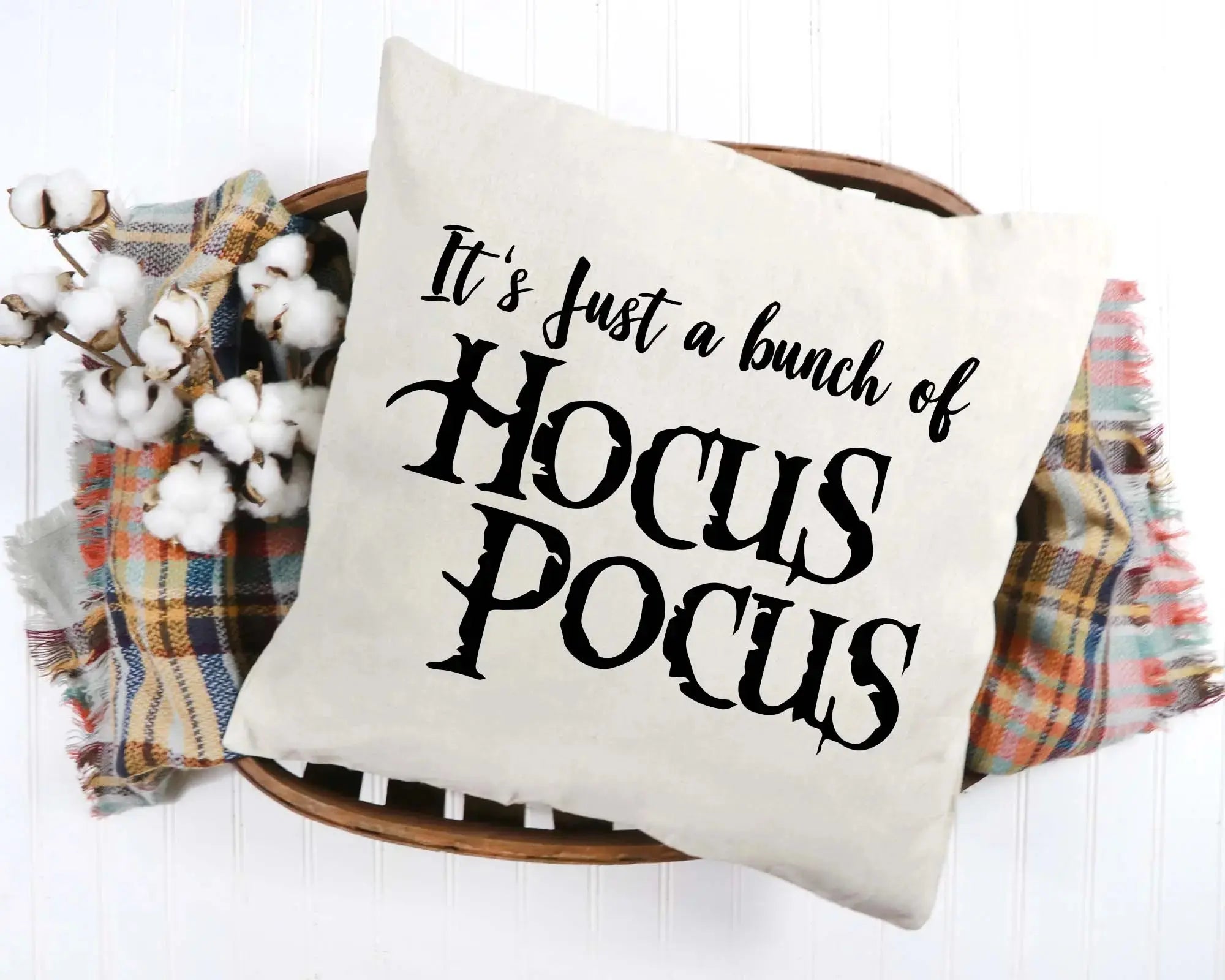 Decorative pillow with 'Hocus Pocus' text on a white background