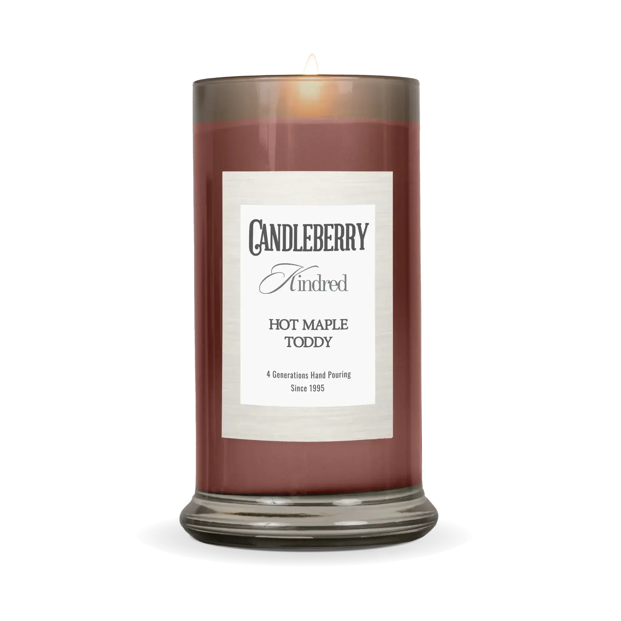 Lit Hot Maple Toddy scented candle in amber glass jar, cozy farmhouse home decor