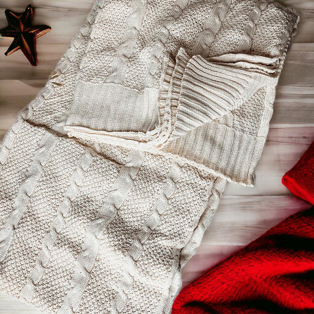 Cozy cream cable knit blanket with rustic star decor, perfect for farmhouse style homes