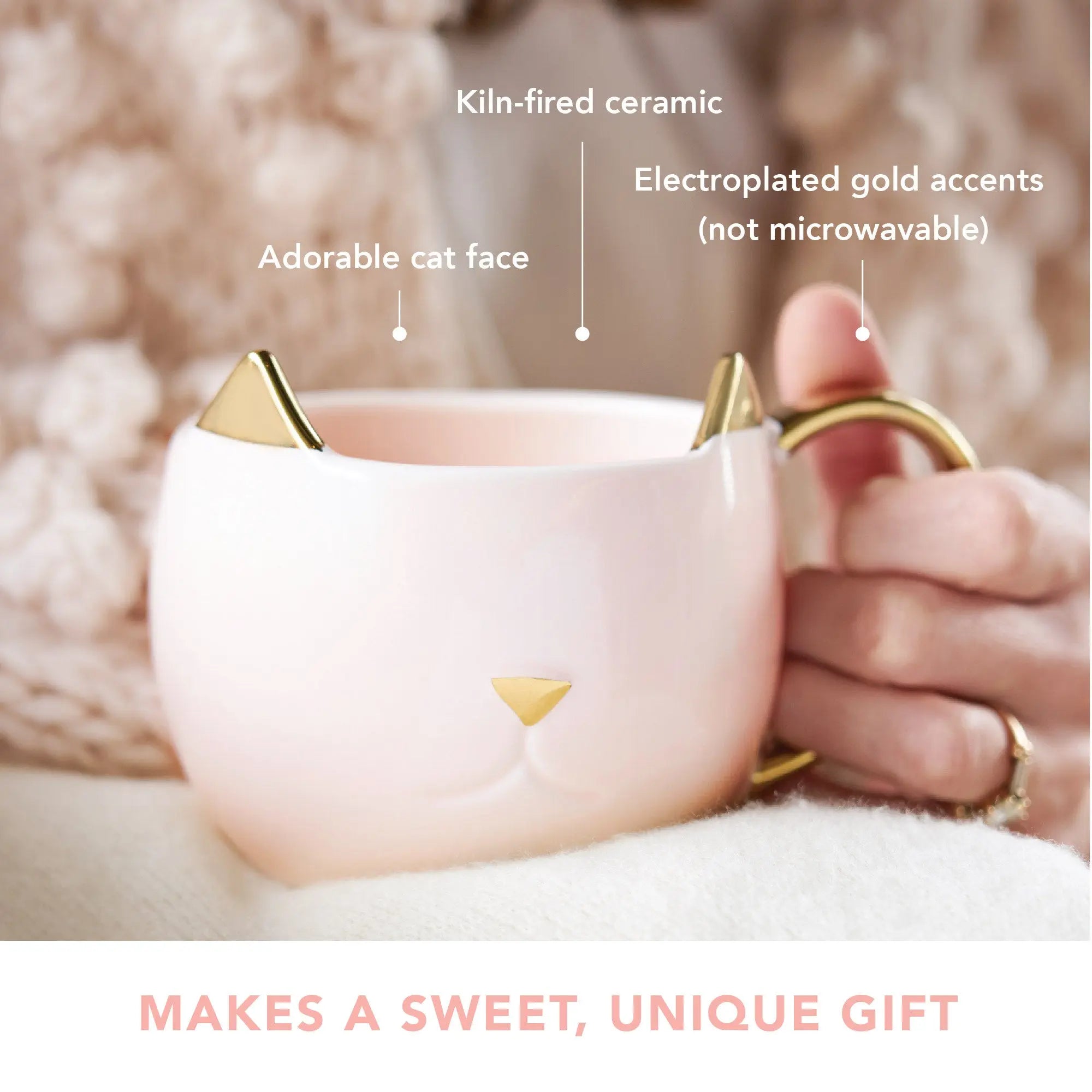 Cat-shaped mug with gold accents held by a hand, labeled features on a soft background.