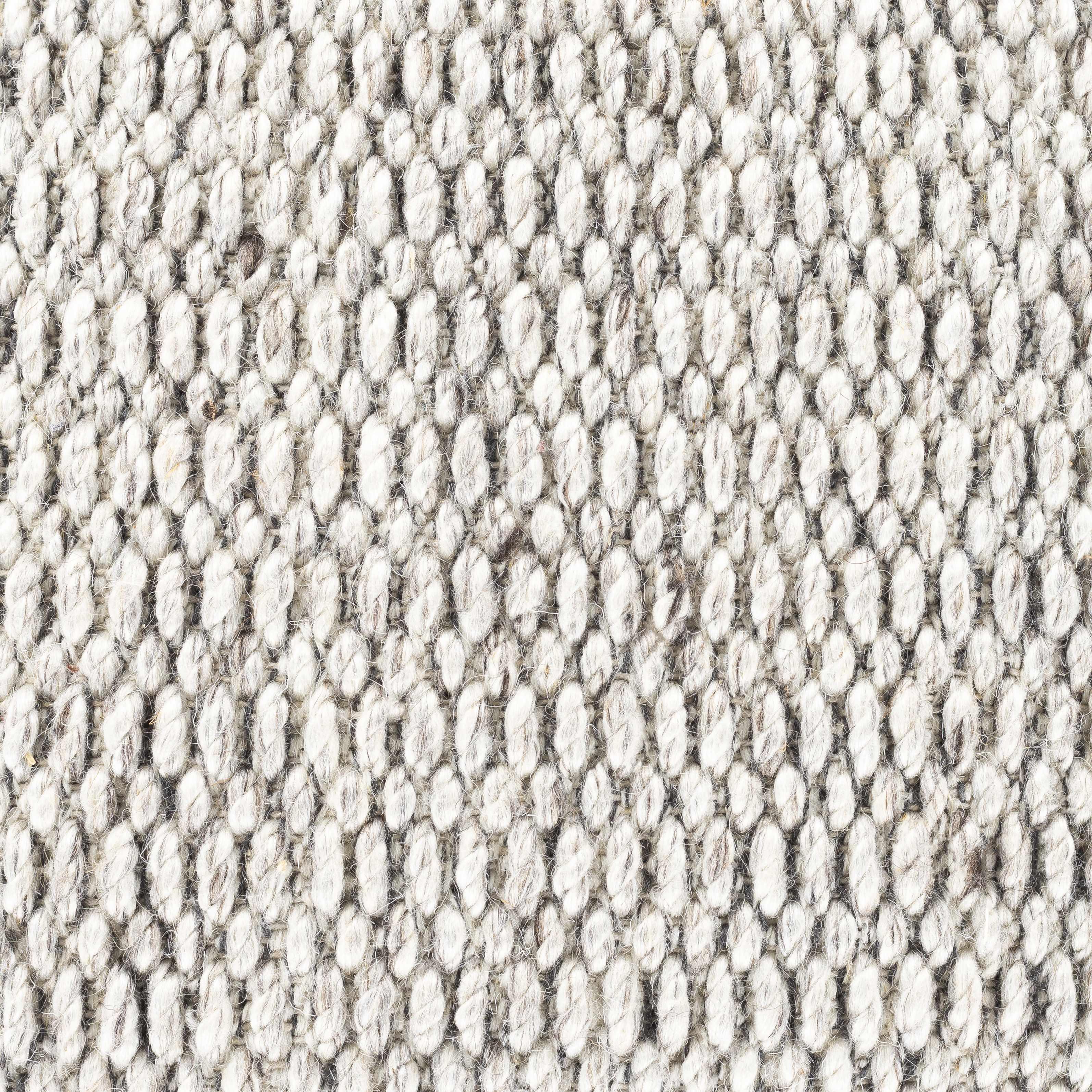 Close-up of textured, neutral-toned woven fabric with a cozy, farmhouse-style knit pattern for home decor.