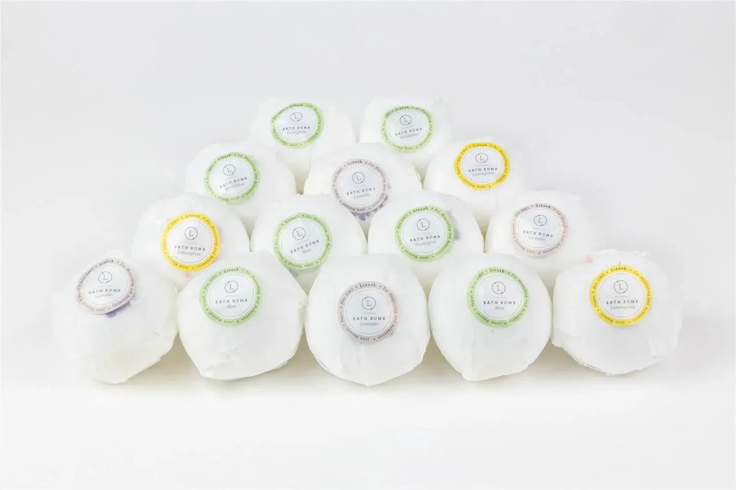 White bath bombs with lavender, mint, and lemongrass scents for cozy home spa relaxation