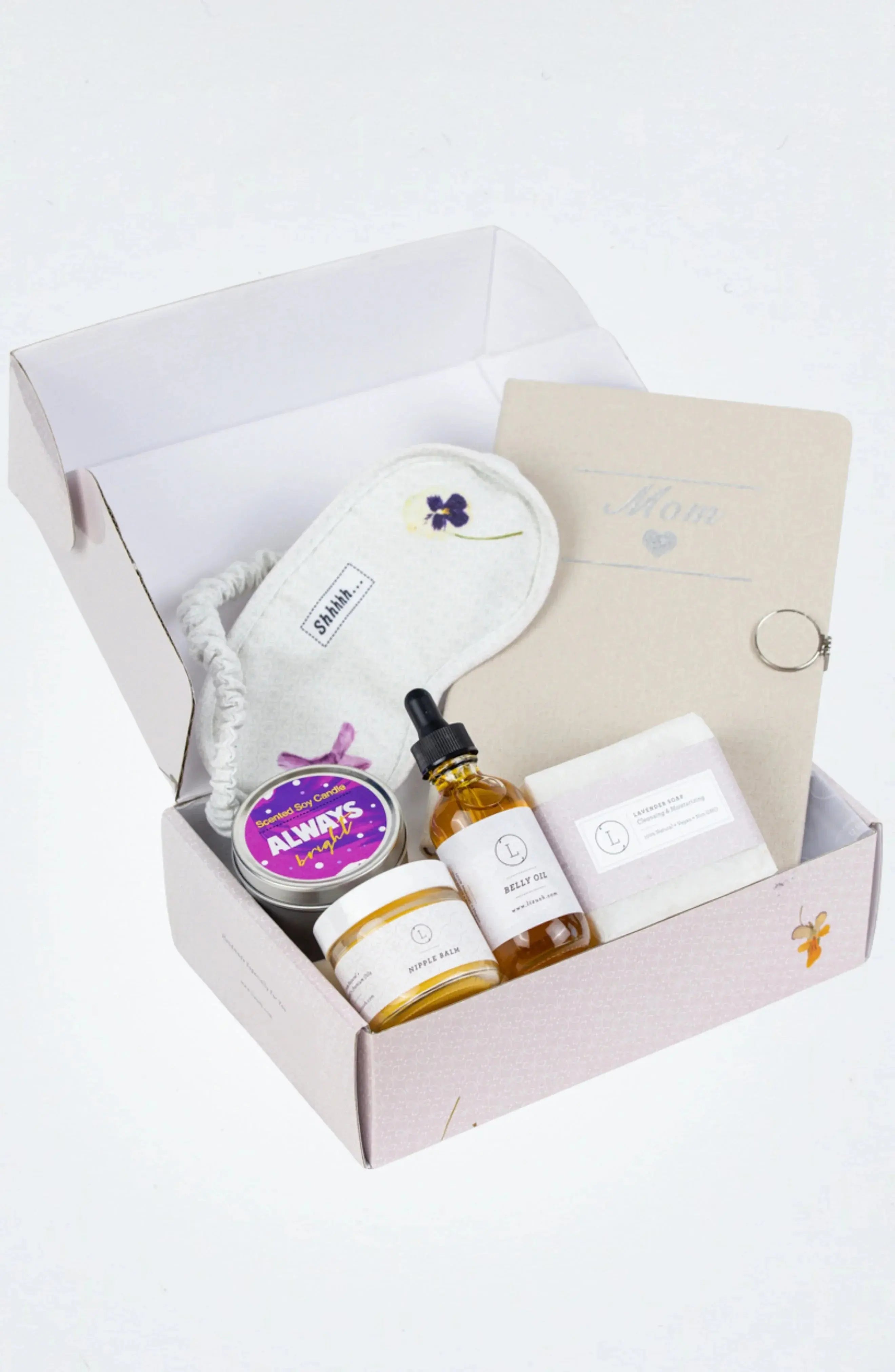 Cozy mom gift box with scented candle, sleep mask, belly oil, nipple balm, and lavender soap for self-care