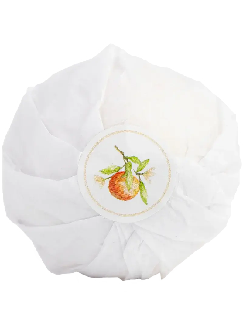 White bath bomb with orange fruit illustration, cozy farmhouse bath essential