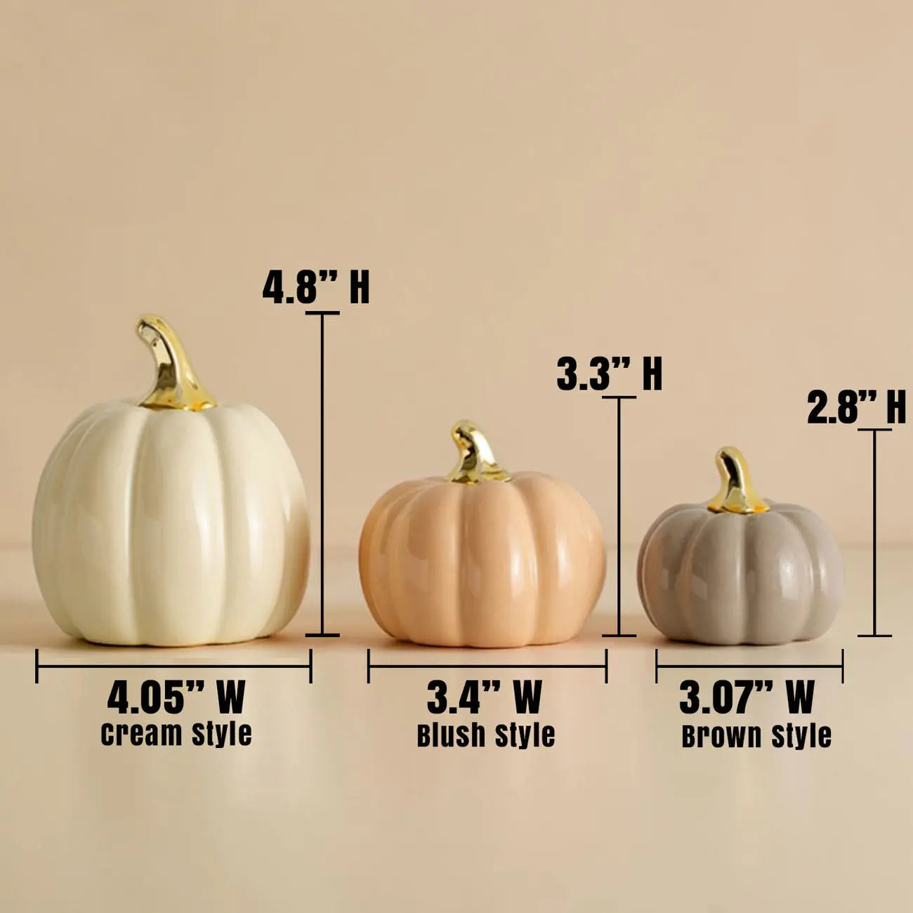 Three decorative pumpkins with measurements on a beige background