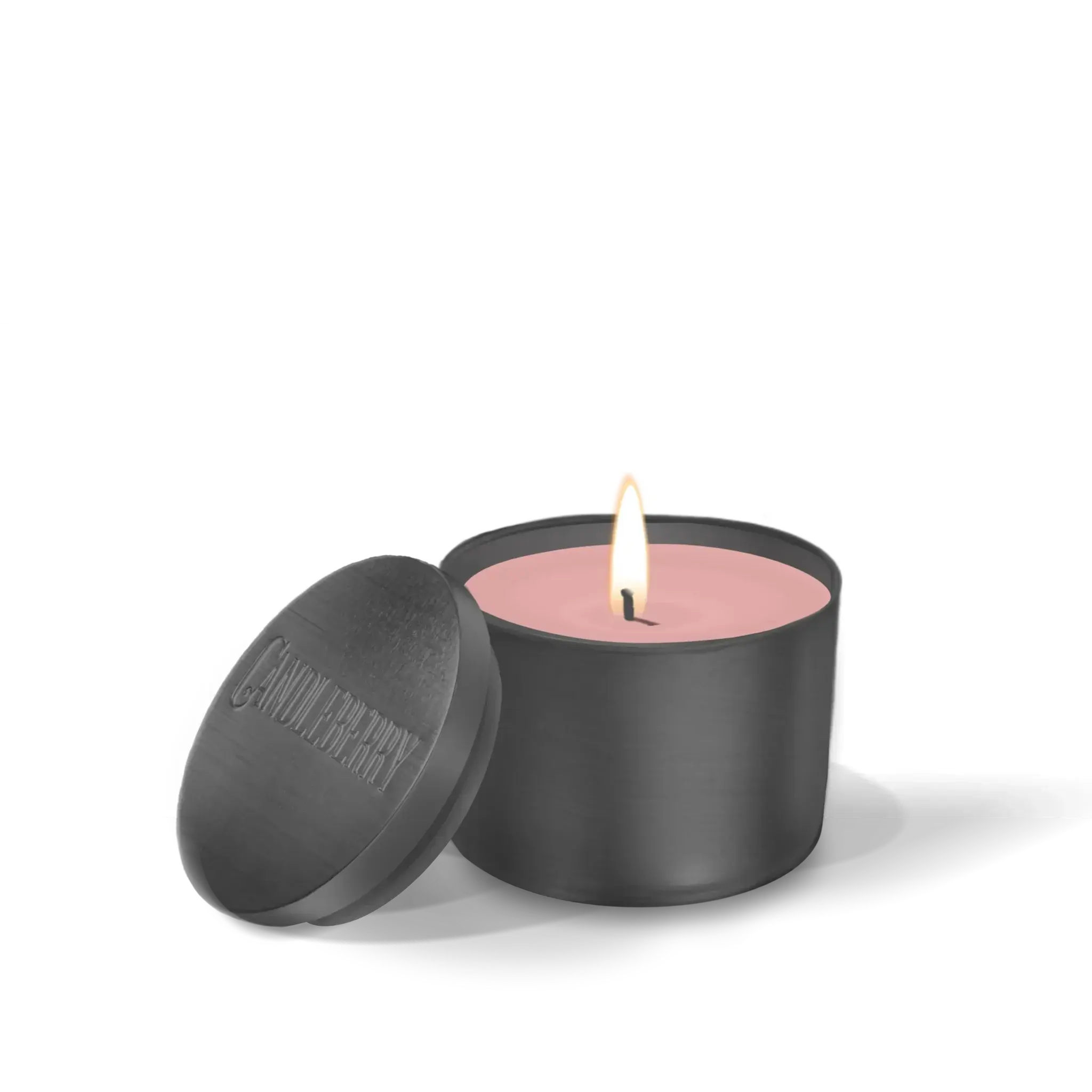 Lit pink candle in matte black jar with lid, cozy home decor accent
