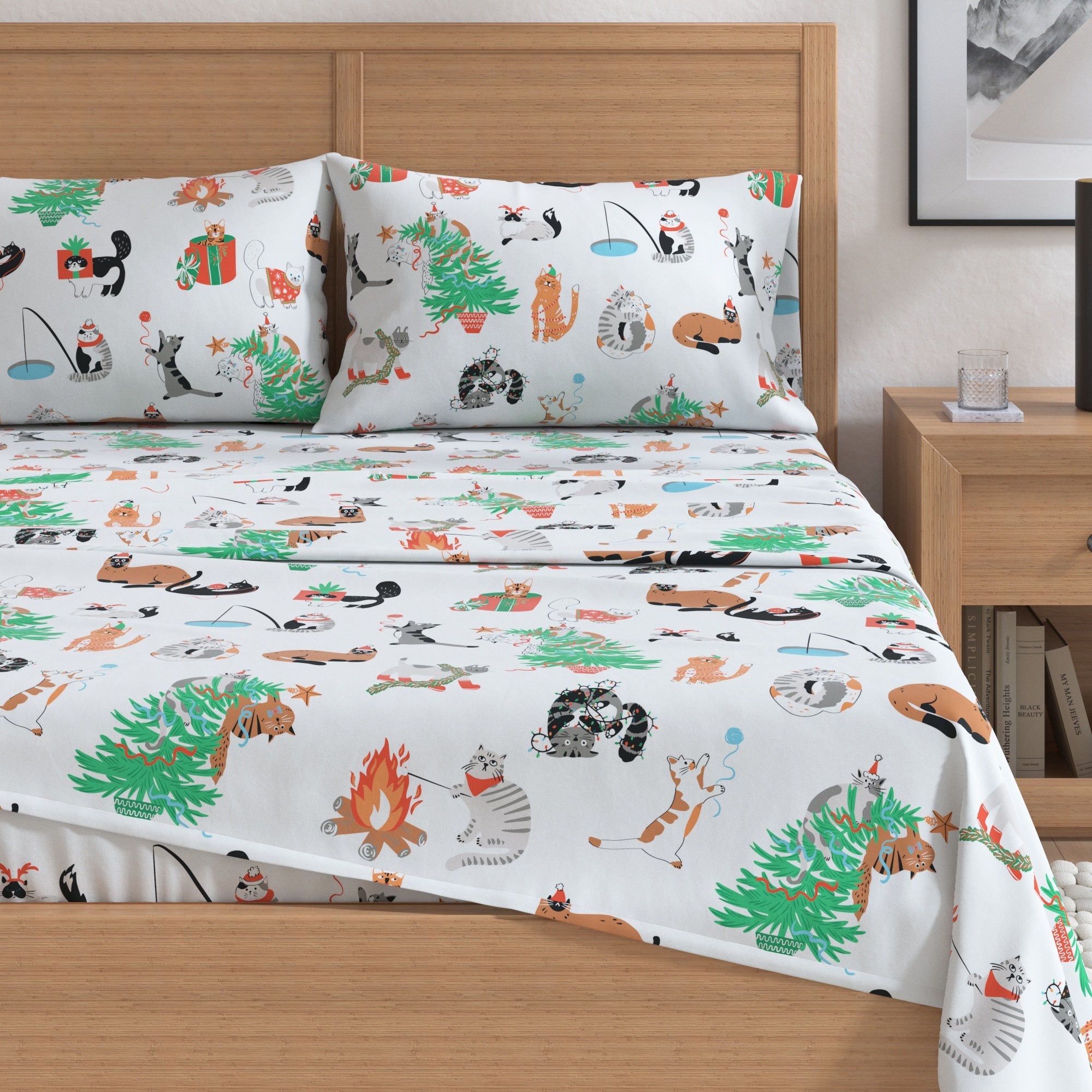 Bed with festive animal-themed bedding set in a bedroom setting.