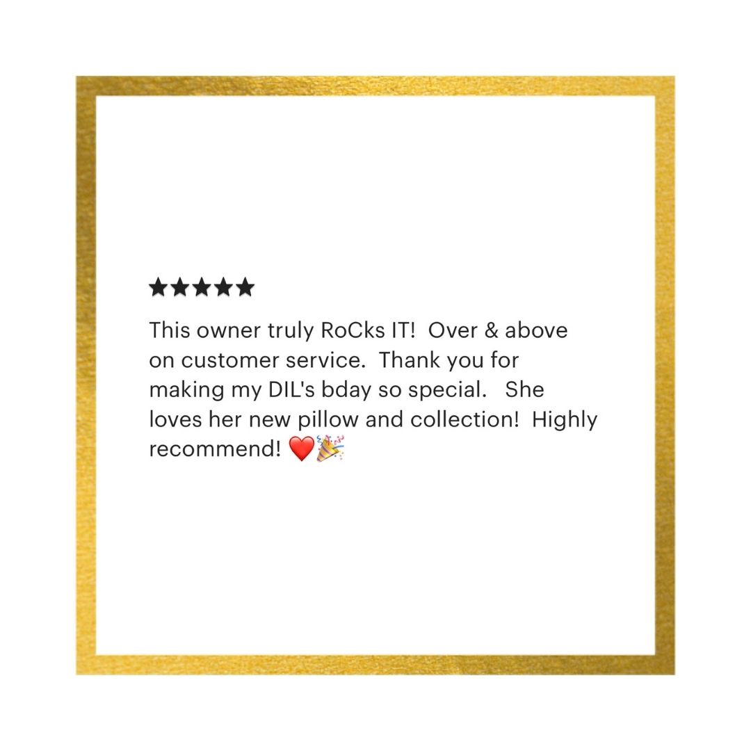 A square white card or print with a textured gold border, featuring a five-star rating and a customer review in black text praising a RoCk brand.