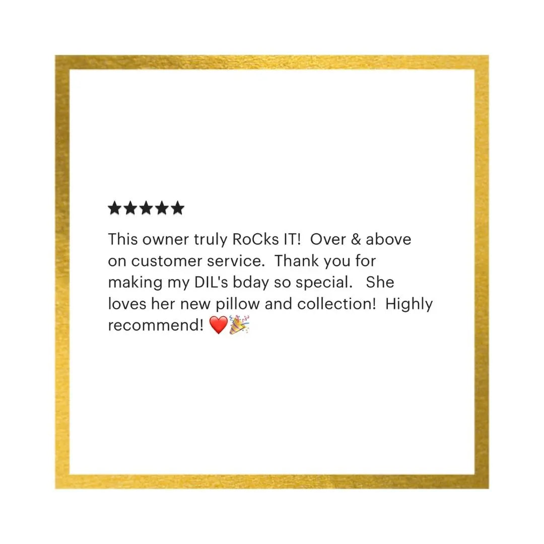 A square white card or print with a textured gold border, featuring a five-star rating and a customer review in black text praising a RoCk brand.