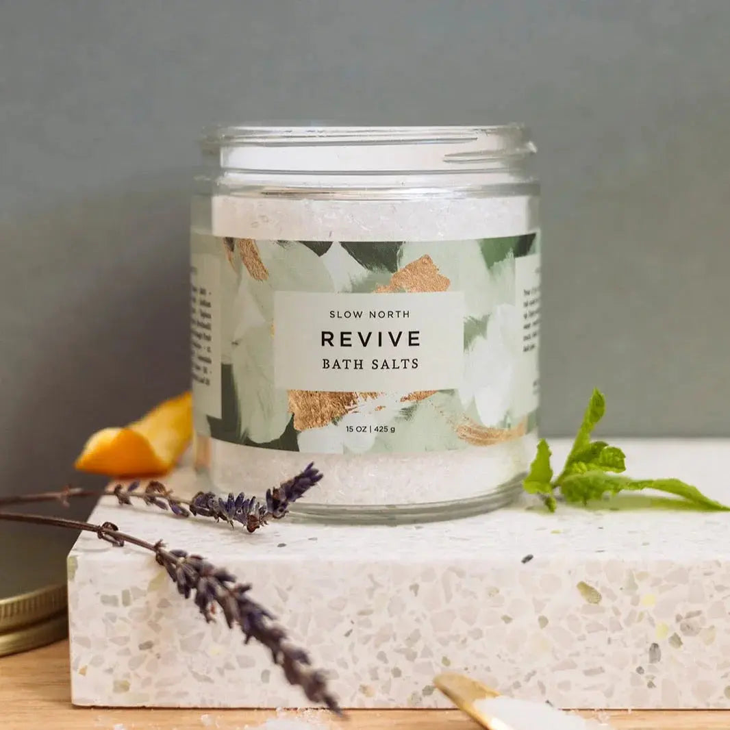 Revive bath salts in a glass jar with lavender and mint, perfect for cozy farmhouse bathroom decor