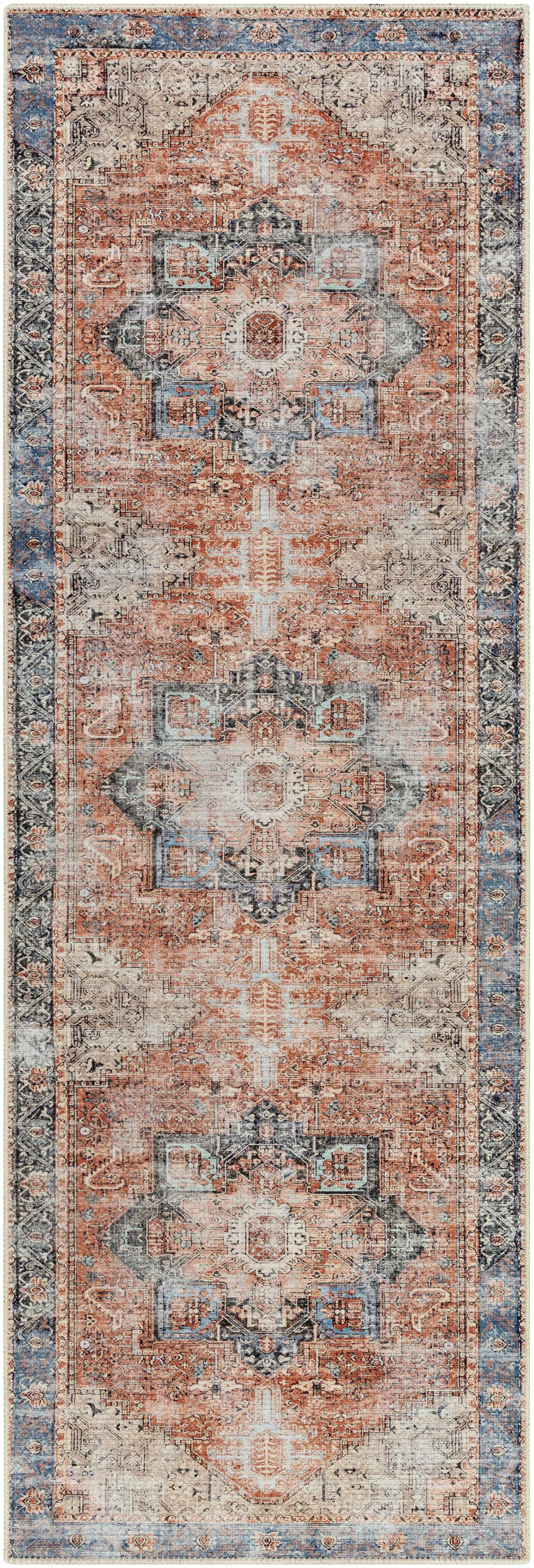 Vintage-inspired farmhouse runner rug with ornate blue and terracotta patterns for cozy cottage decor