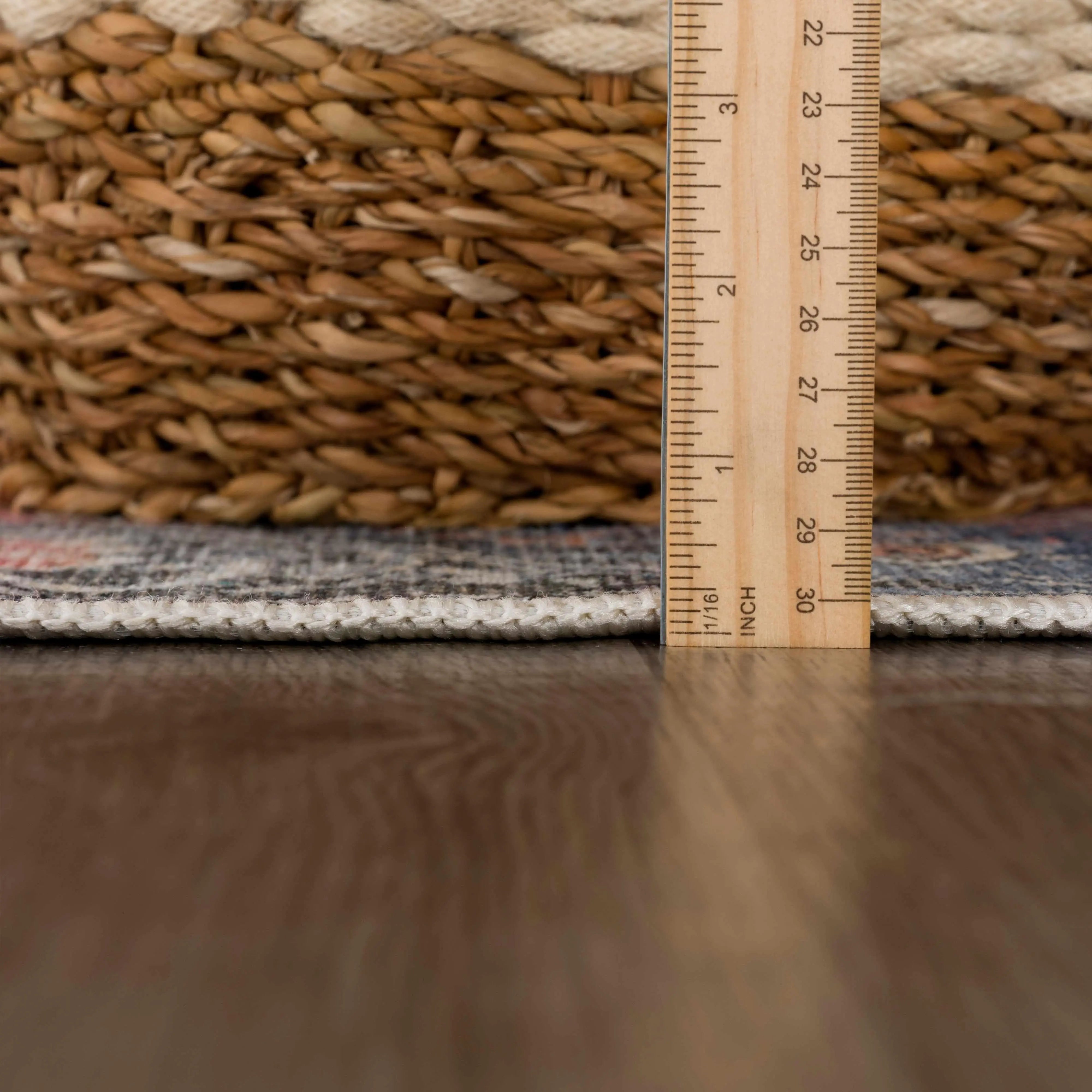Woven basket with wooden ruler measuring height, cozy farmhouse decor