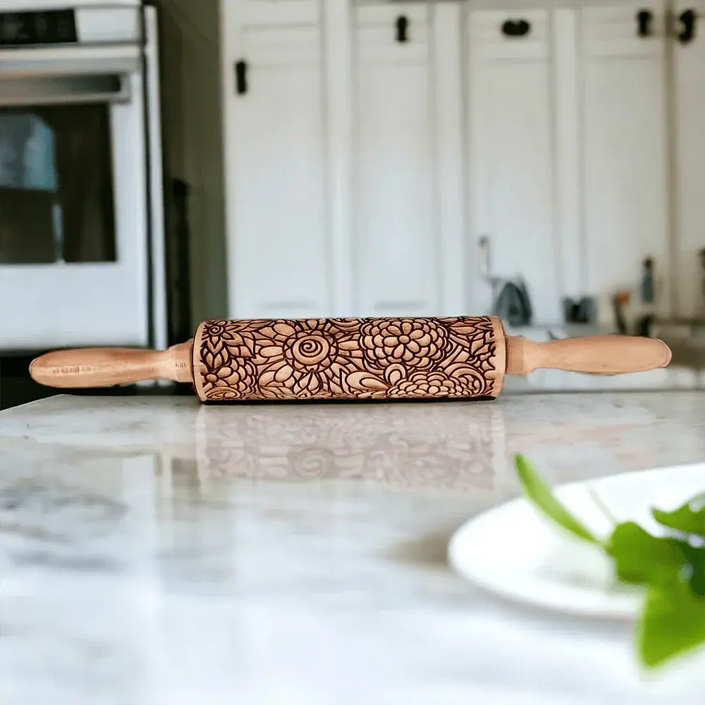 Decorative rolling pin on a kitchen counter with blurred background