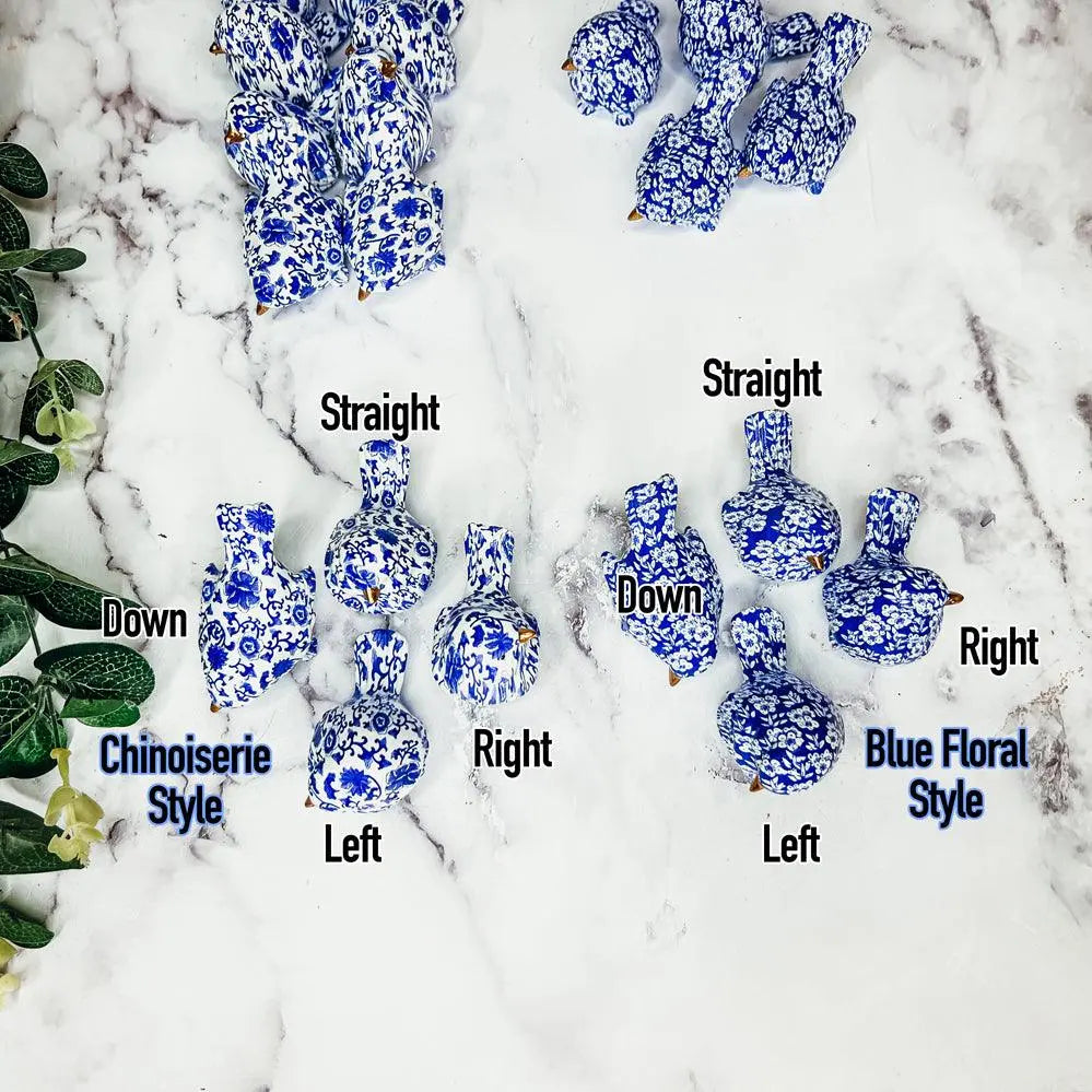 Blue and white ceramic ducks in various poses on a snowy background