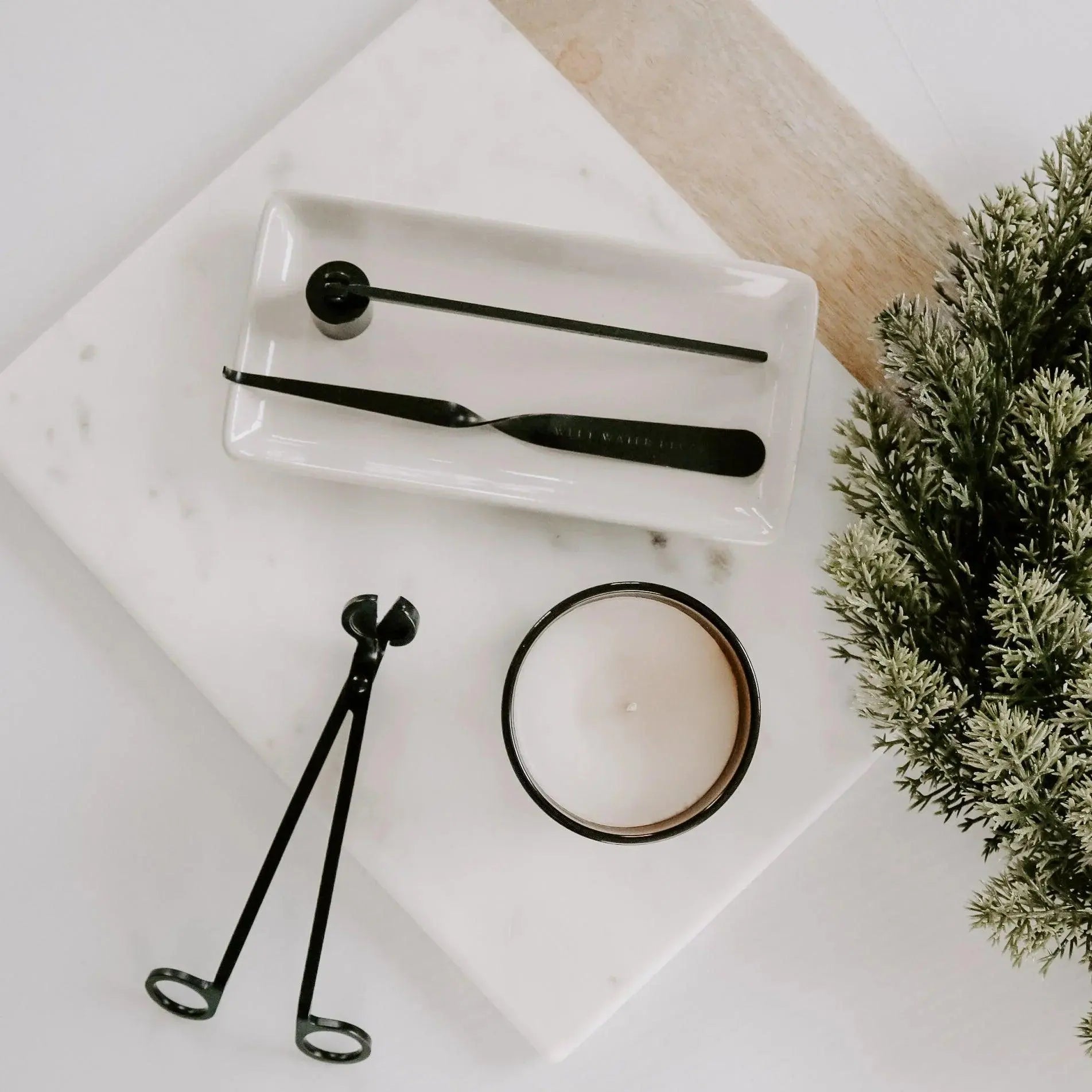 Black candle care tools with white candle on marble tray, farmhouse decor essentials