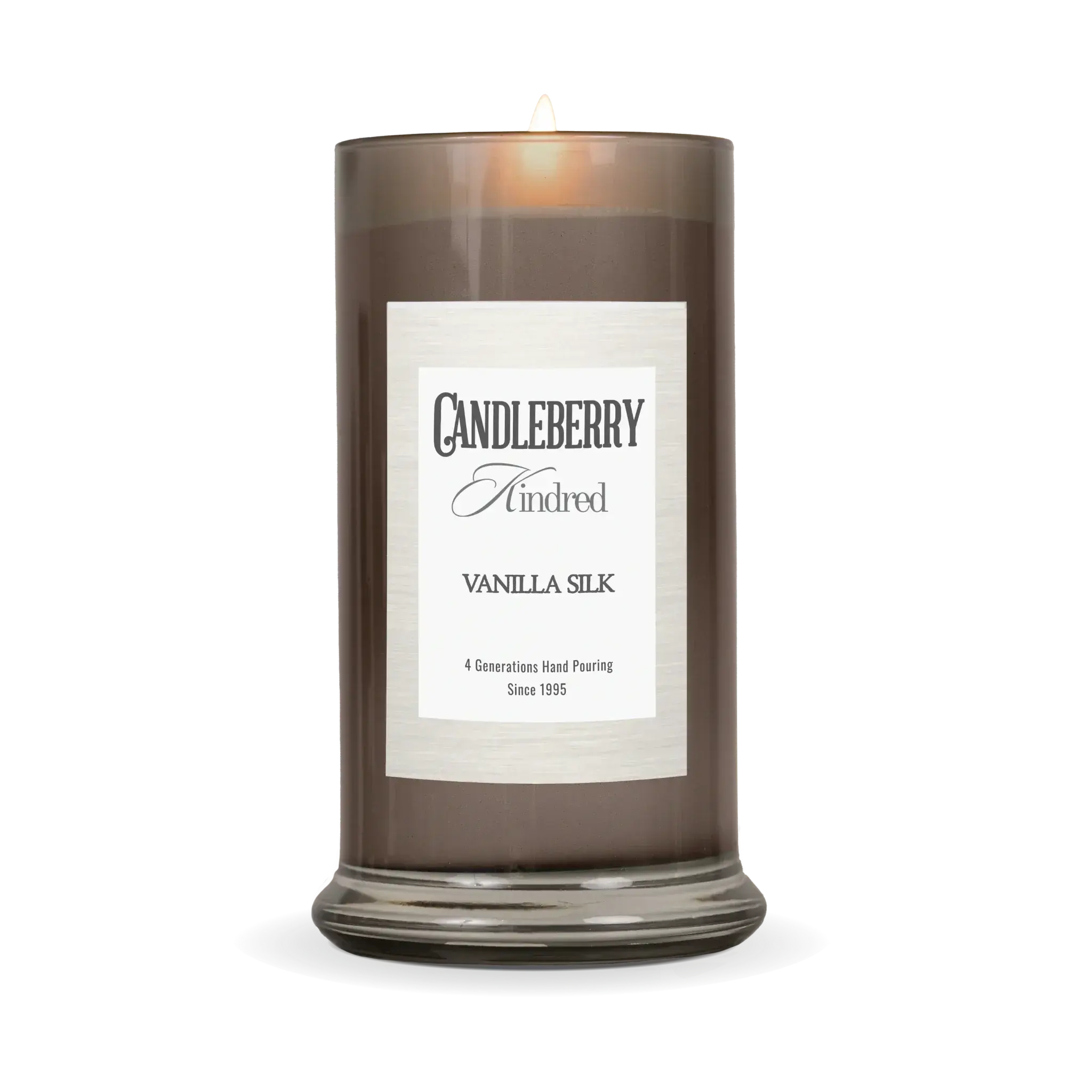 Vanilla Silk scented candle in smoky glass jar, cozy home decor with warm glow