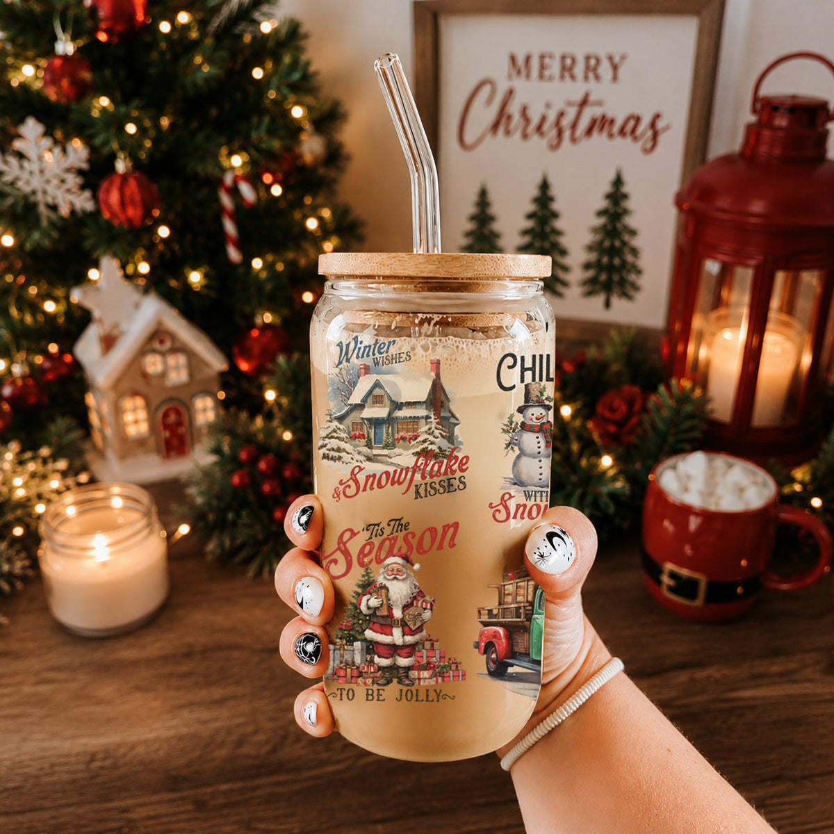 Hand holding a Christmas-themed tumbler with a festive background