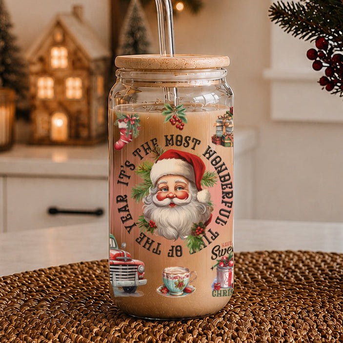 Glass jar with wooden lid featuring Christmas-themed design and Santa Claus illustration, placed on a woven surface.