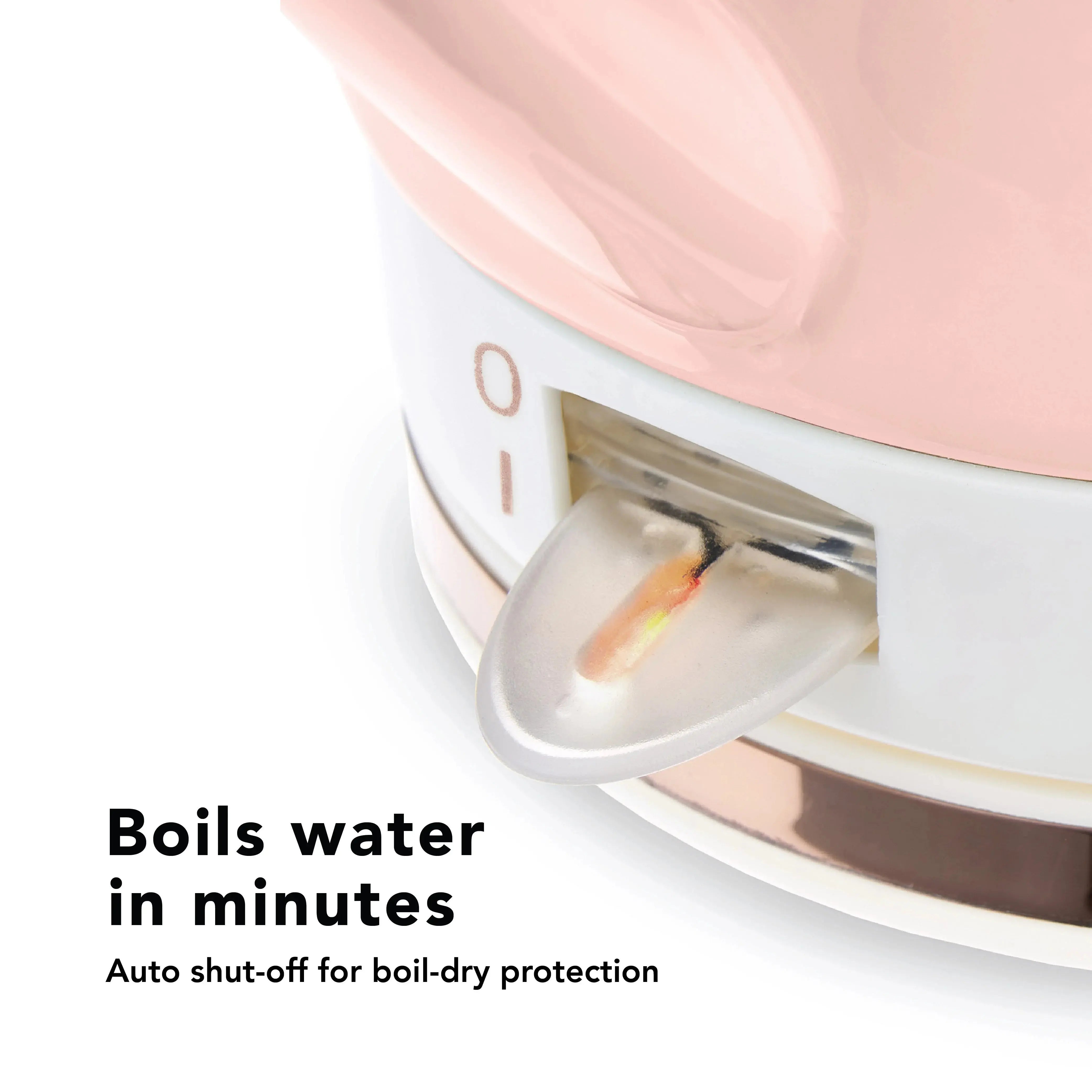 Pink electric kettle on a kitchen counter showing text "Boils water in minutes"