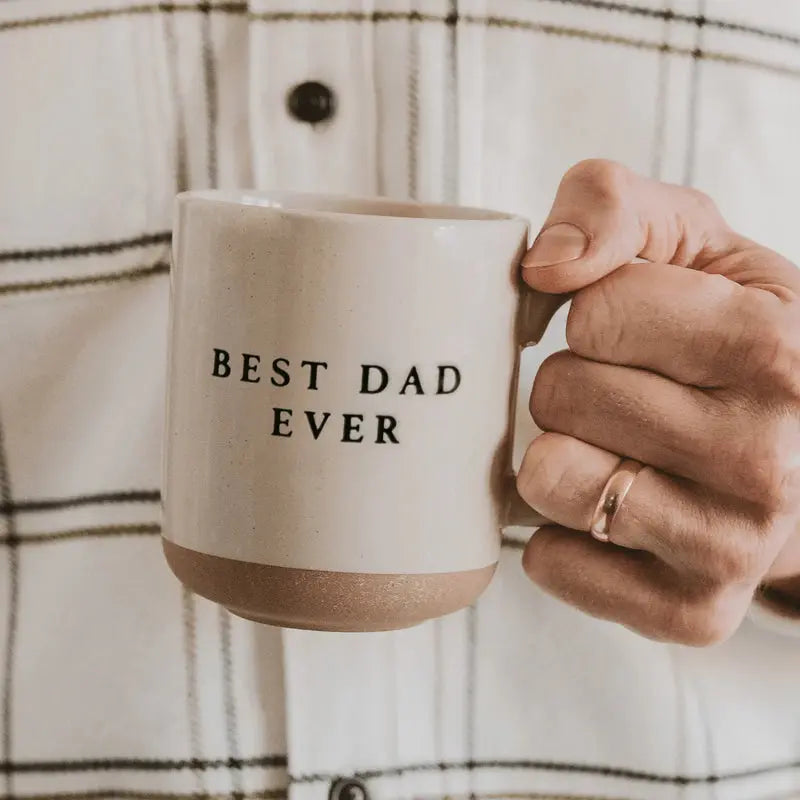 Best Dad Ever ceramic mug, cozy farmhouse style gift for father, held in hand against plaid shirt