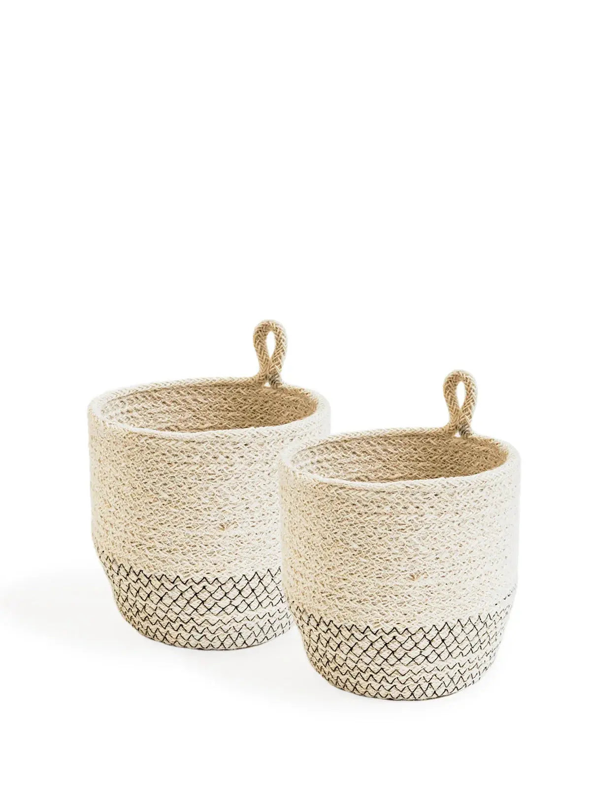 Set of two farmhouse-style woven baskets with black patterned base and loop handles, perfect for cozy home decor