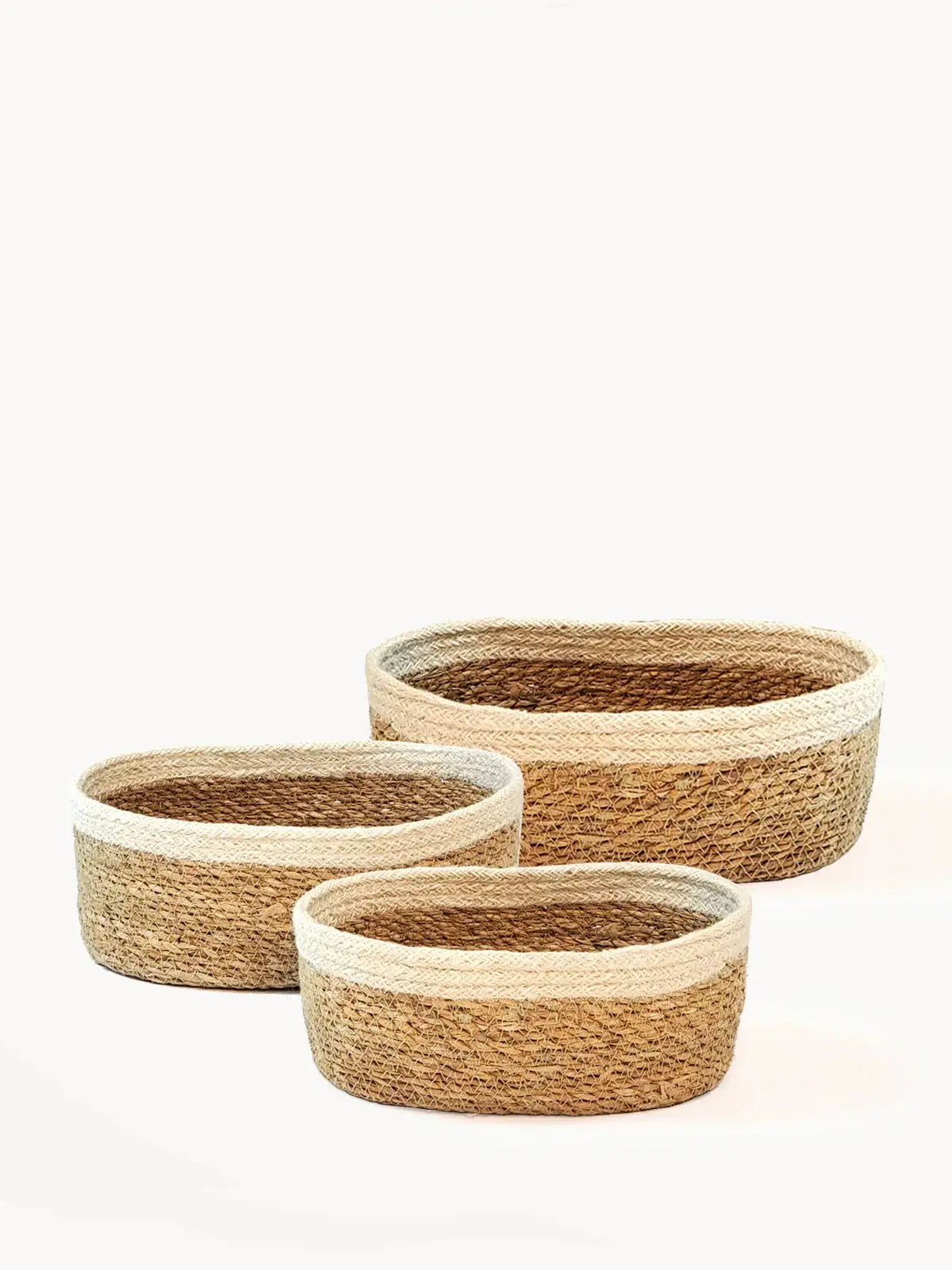 Set of three woven seagrass baskets with cream trim, farmhouse decor storage