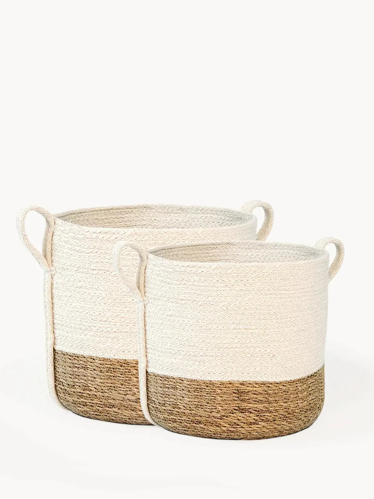 Set of two farmhouse-style woven storage baskets with natural jute base and cream top, ideal for cozy home decor