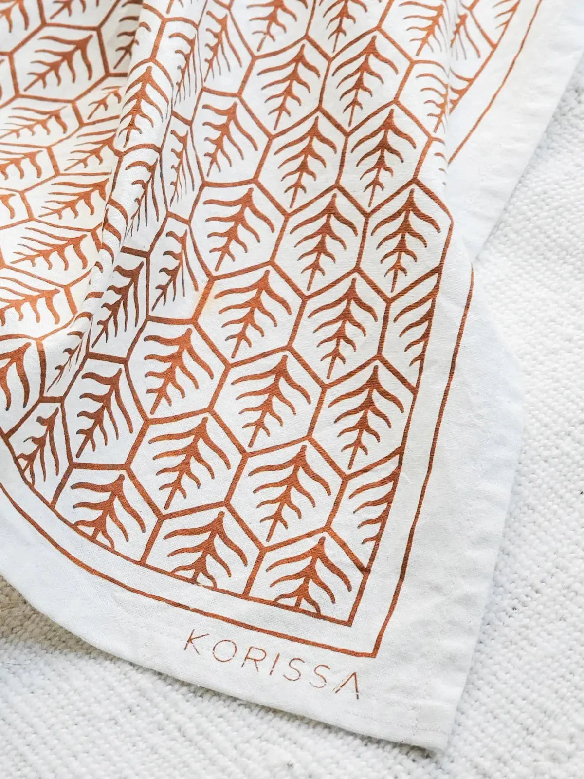 White tea towel with rust-colored leaf pattern, farmhouse kitchen decor, Korissa brand
