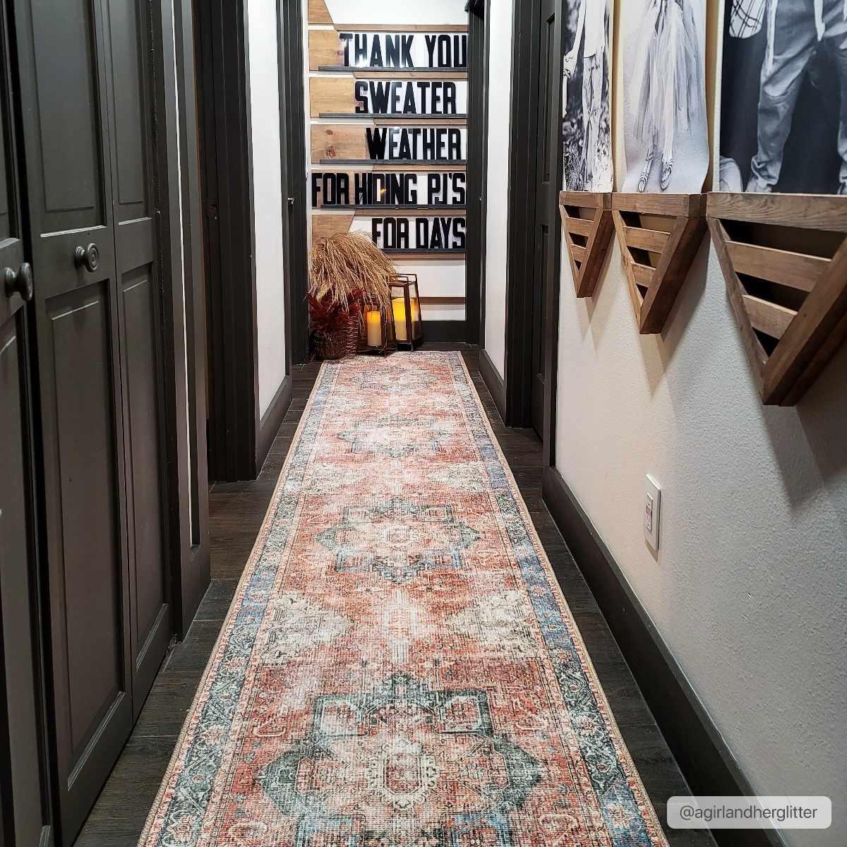 Vintage-style runner rug in farmhouse hallway with wooden signs and cozy decor