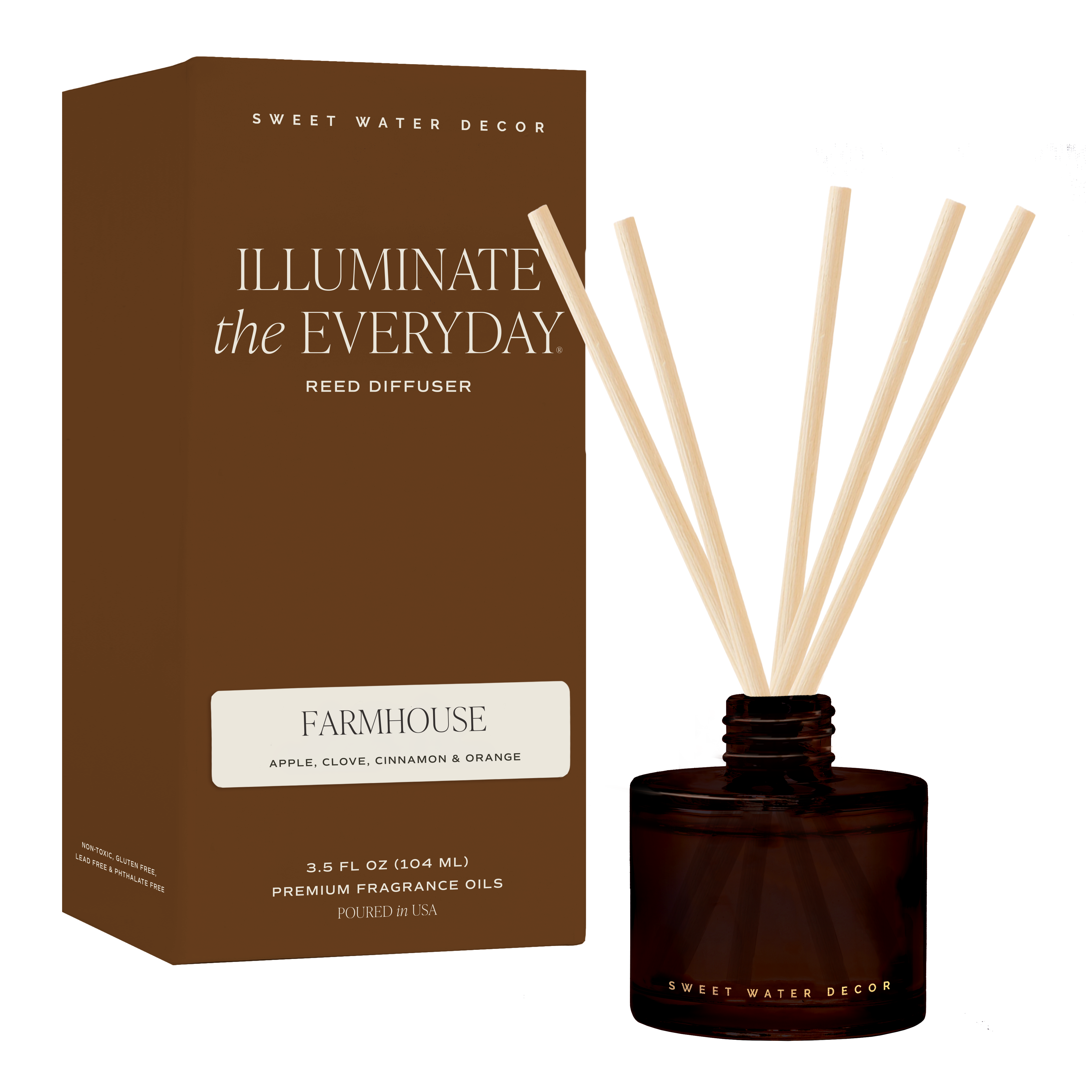 Farmhouse amber tinted glass reed diffuser with natural rattan reeds and warm pumpkin, apple, cinnamon, caramel, and vanilla fall fragrance.