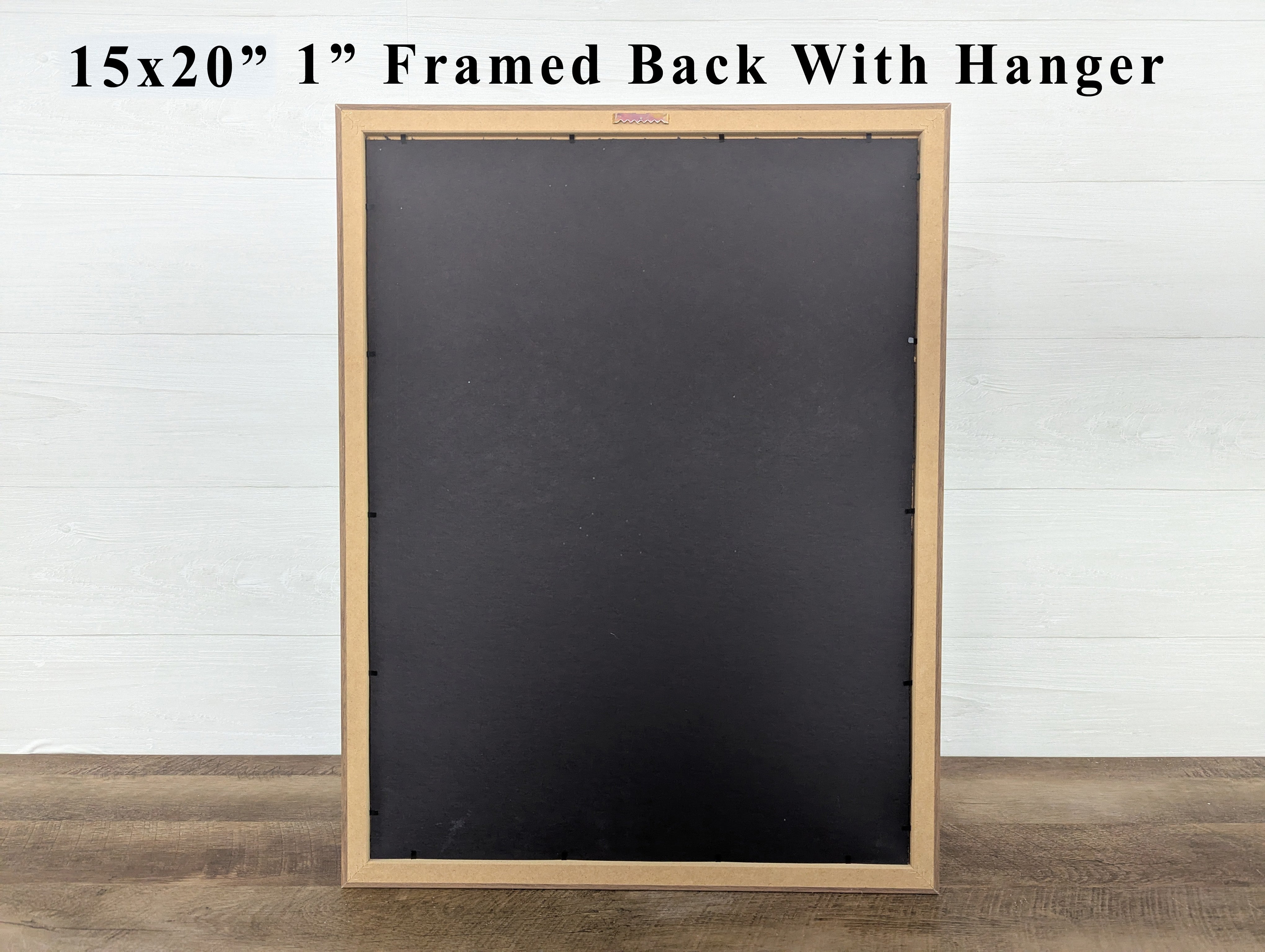 Blackboard with wooden frame and hanger on a white wall background