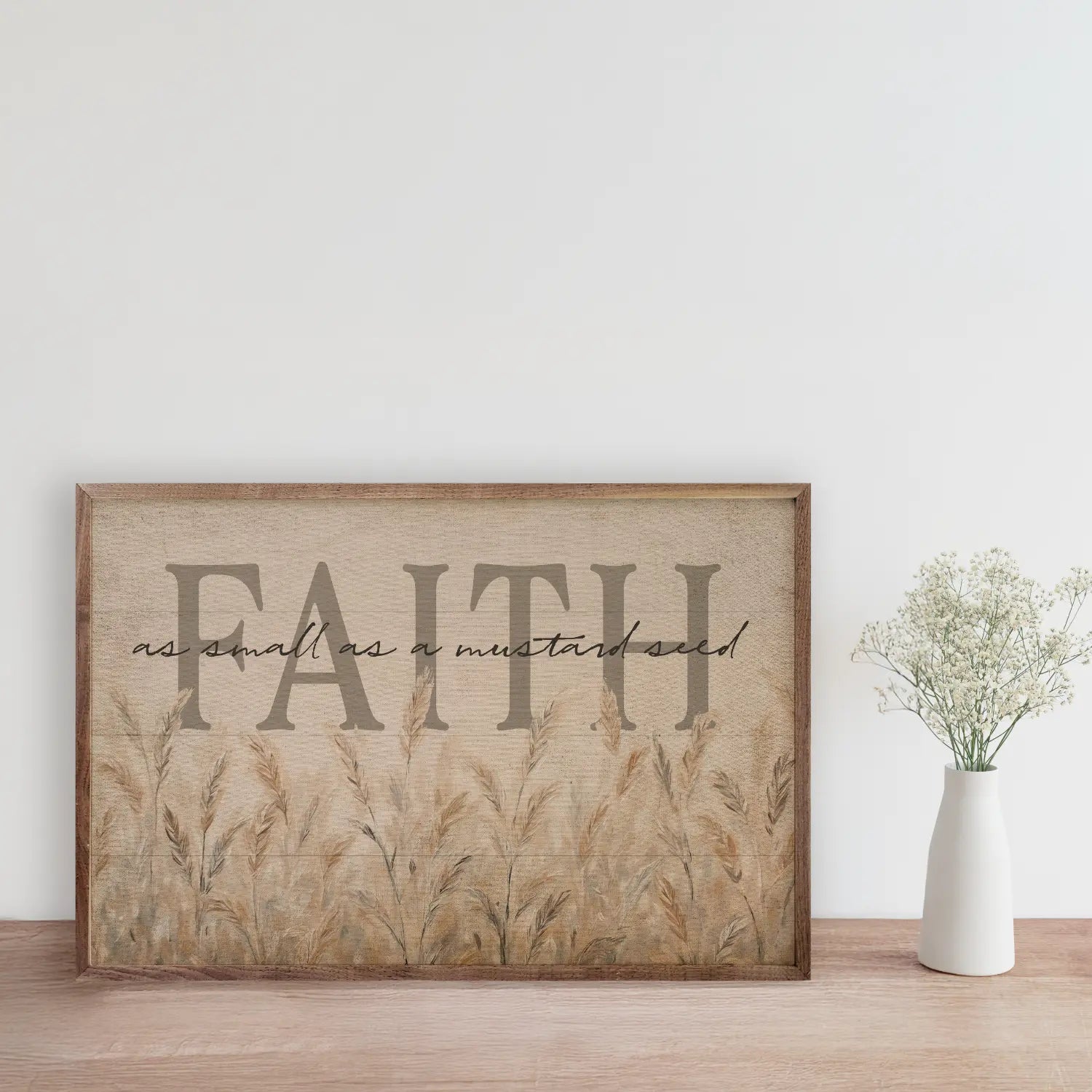 Framed artwork with 'FAITH as small as a mustard seed' text on a wall.