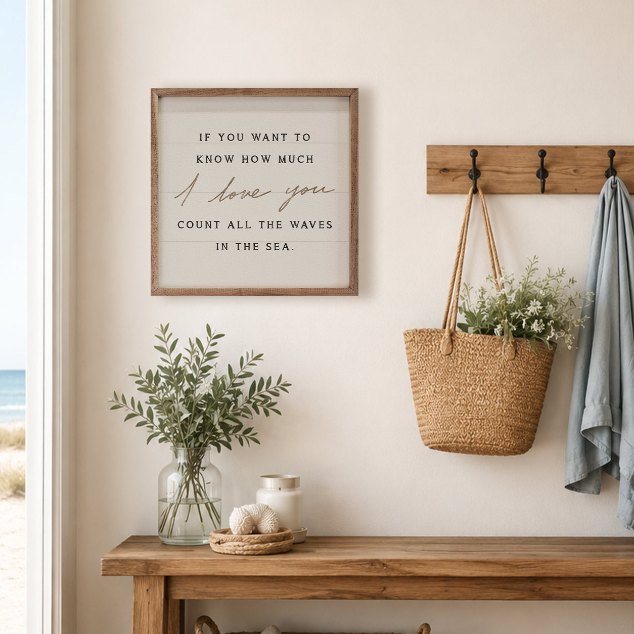 Nautical-themed decor with a framed quote, woven basket, and plants on a wooden console table.