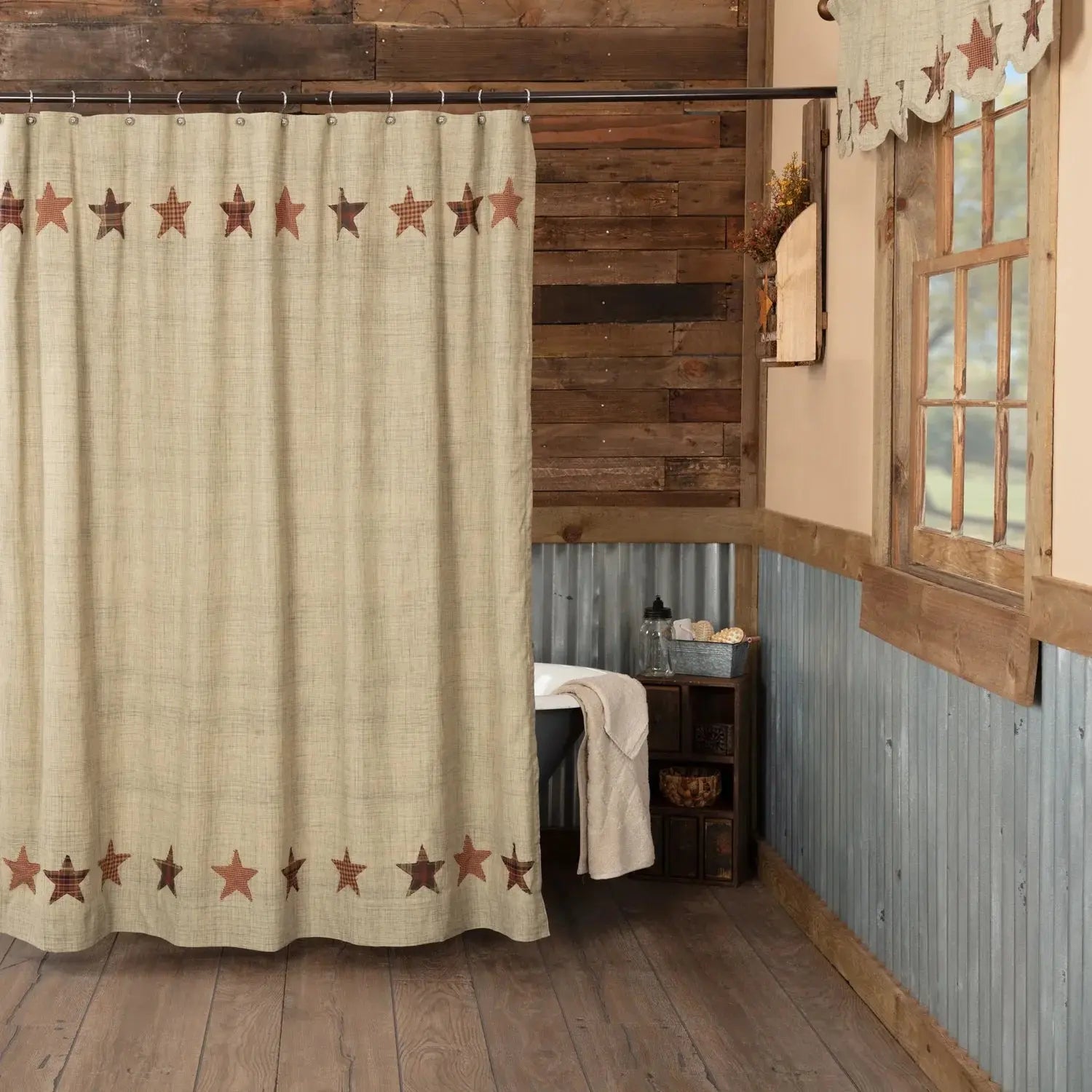 Shower curtain with star pattern in a rustic bathroom setting