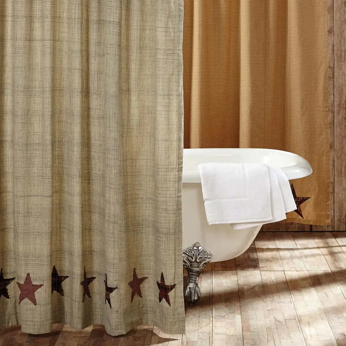 Beige shower curtain with star patterns in a bathroom setting