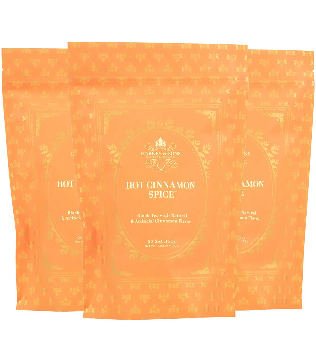 Hot Cinnamon Spice black tea sachets in orange packaging with gold accents, cozy home decor gift