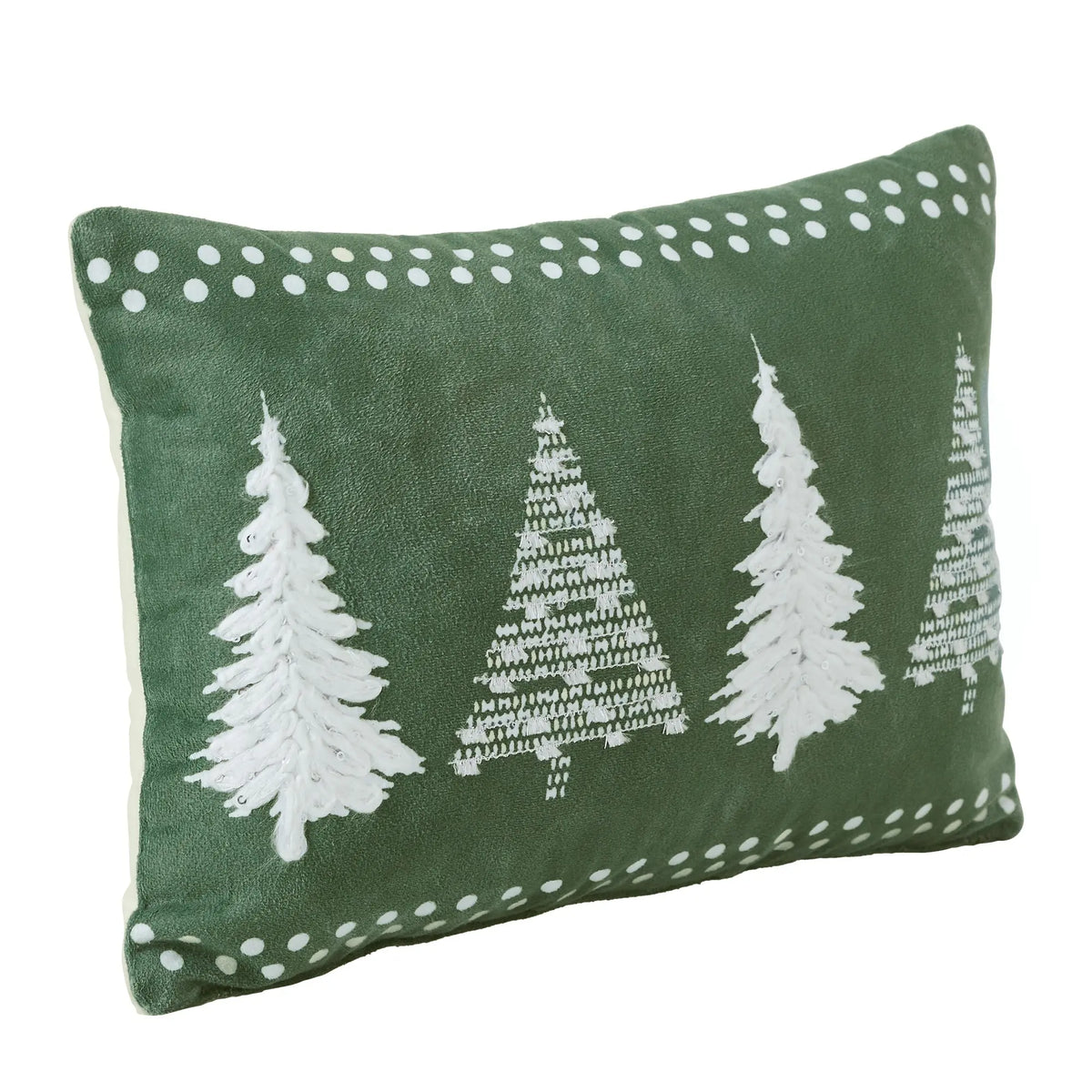 A rectangular green throw pillow featuring three white embroidered Christmas trees, white dotted border details, and a white piping edge, shown on a plain white background.