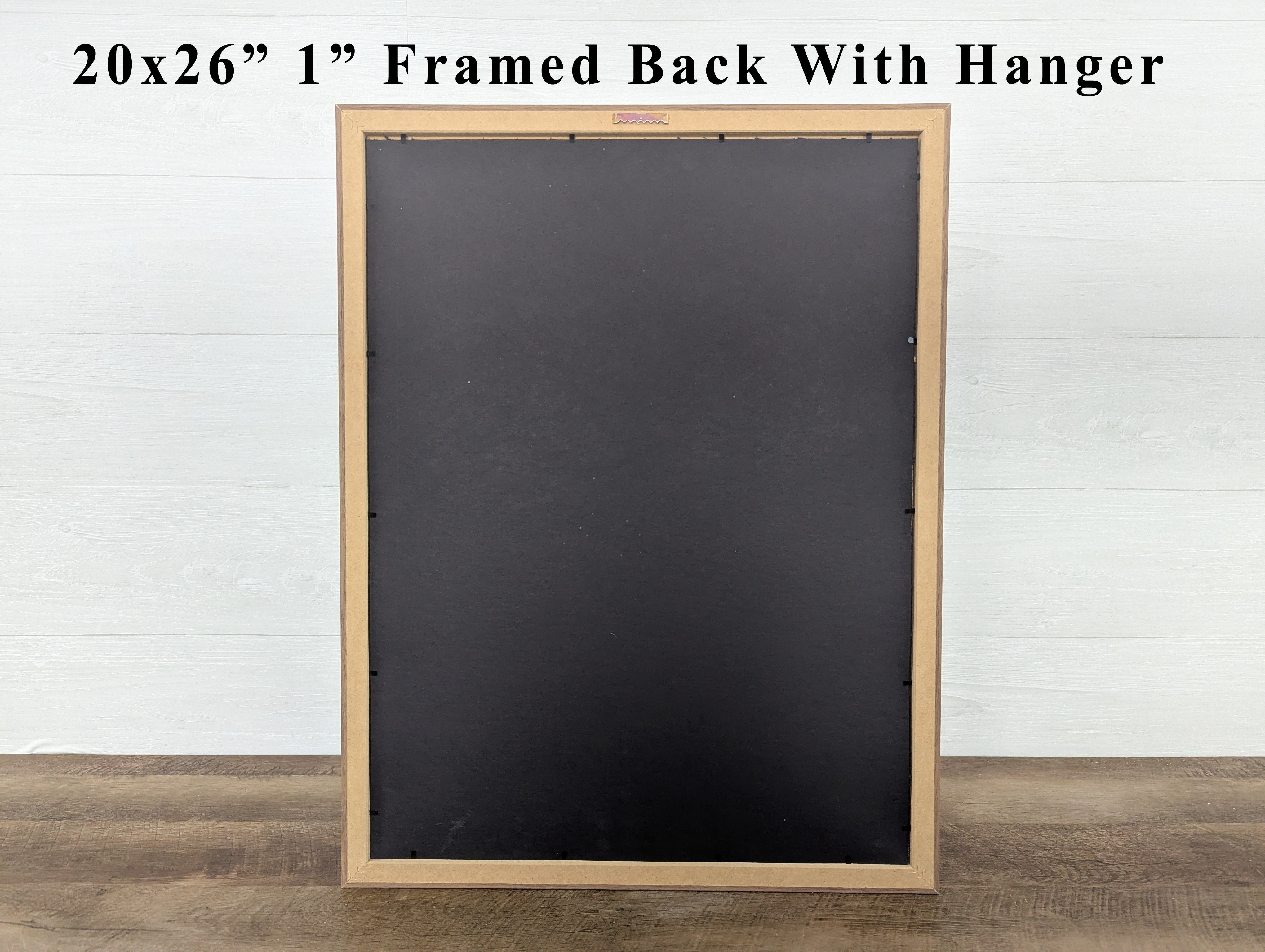 Blackboard with wooden frame and hanger on a white wall background