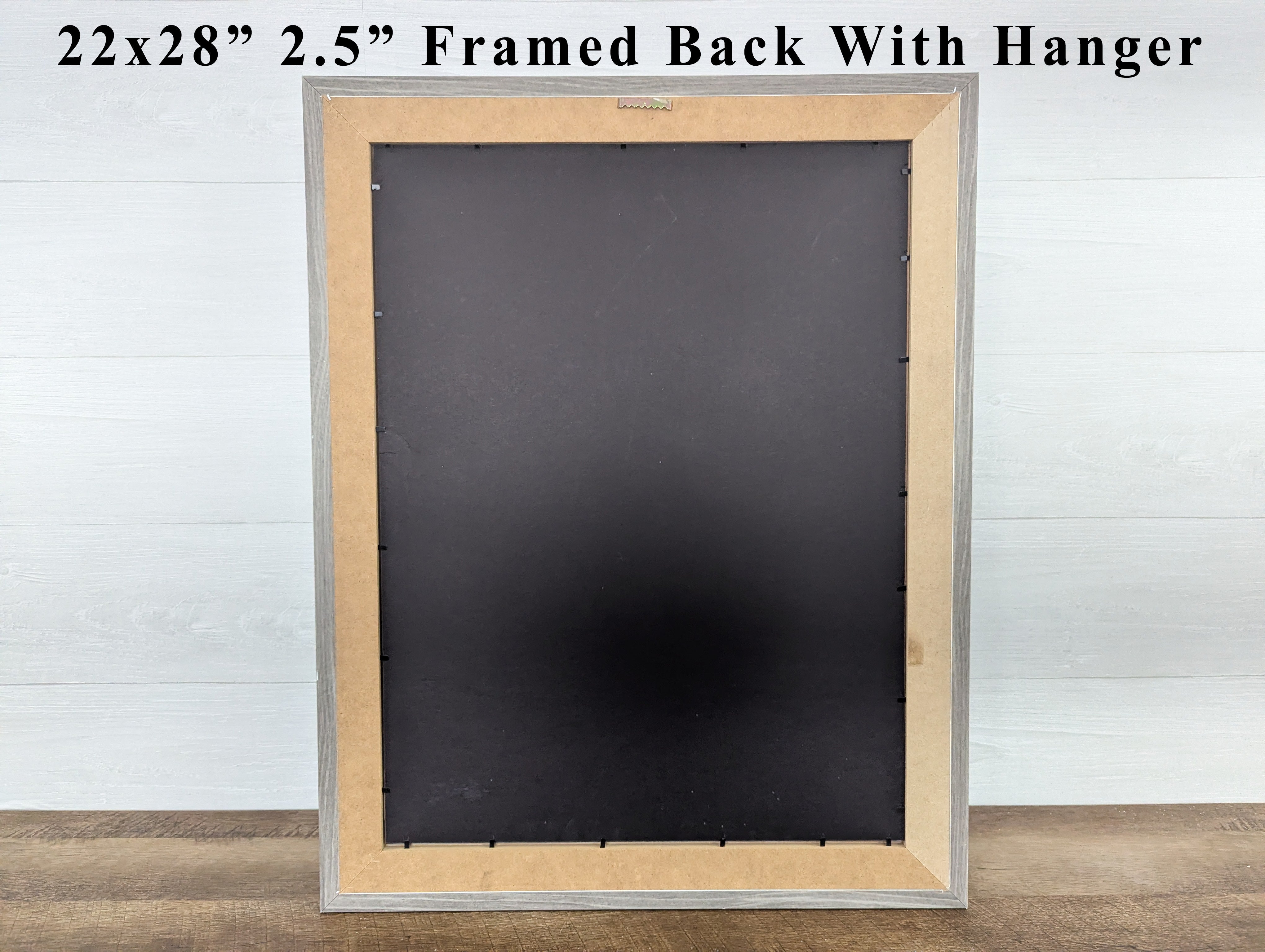 Framed black board with wooden frame and hanger on a white background